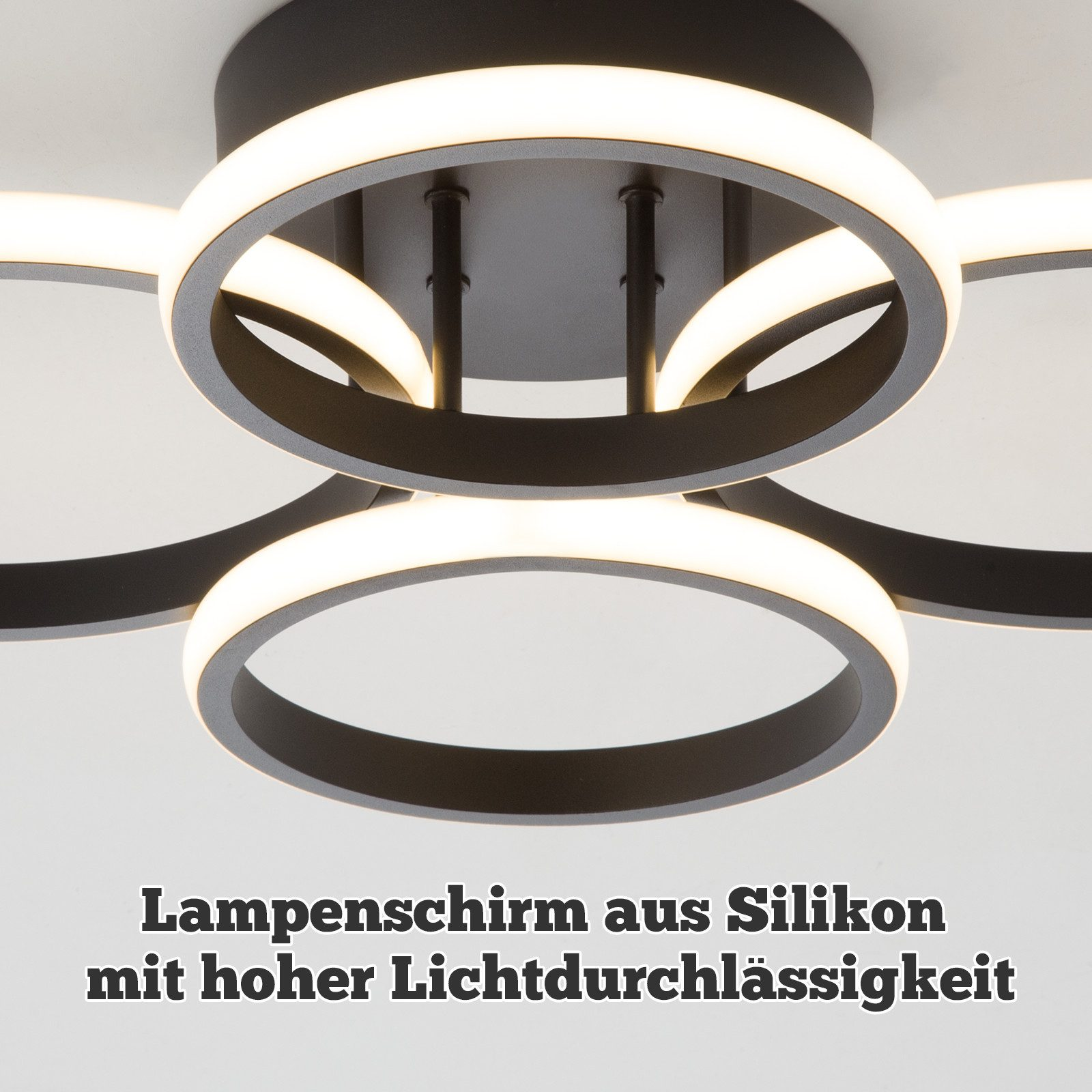Lampa sufitowa z ciemnoszarymi pierścieniami z wewnętrznym światłem. Tło jest białe.