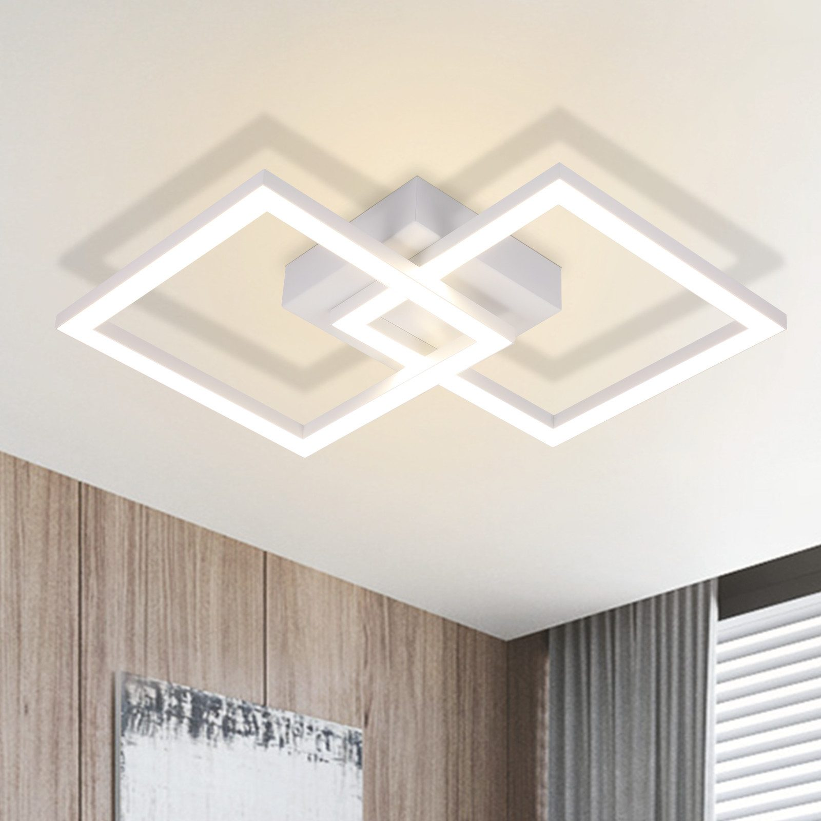 Lampada da soffitto quadrata bianca. Due quadrati sovrapposti con sfondo bianco e parete in legno.