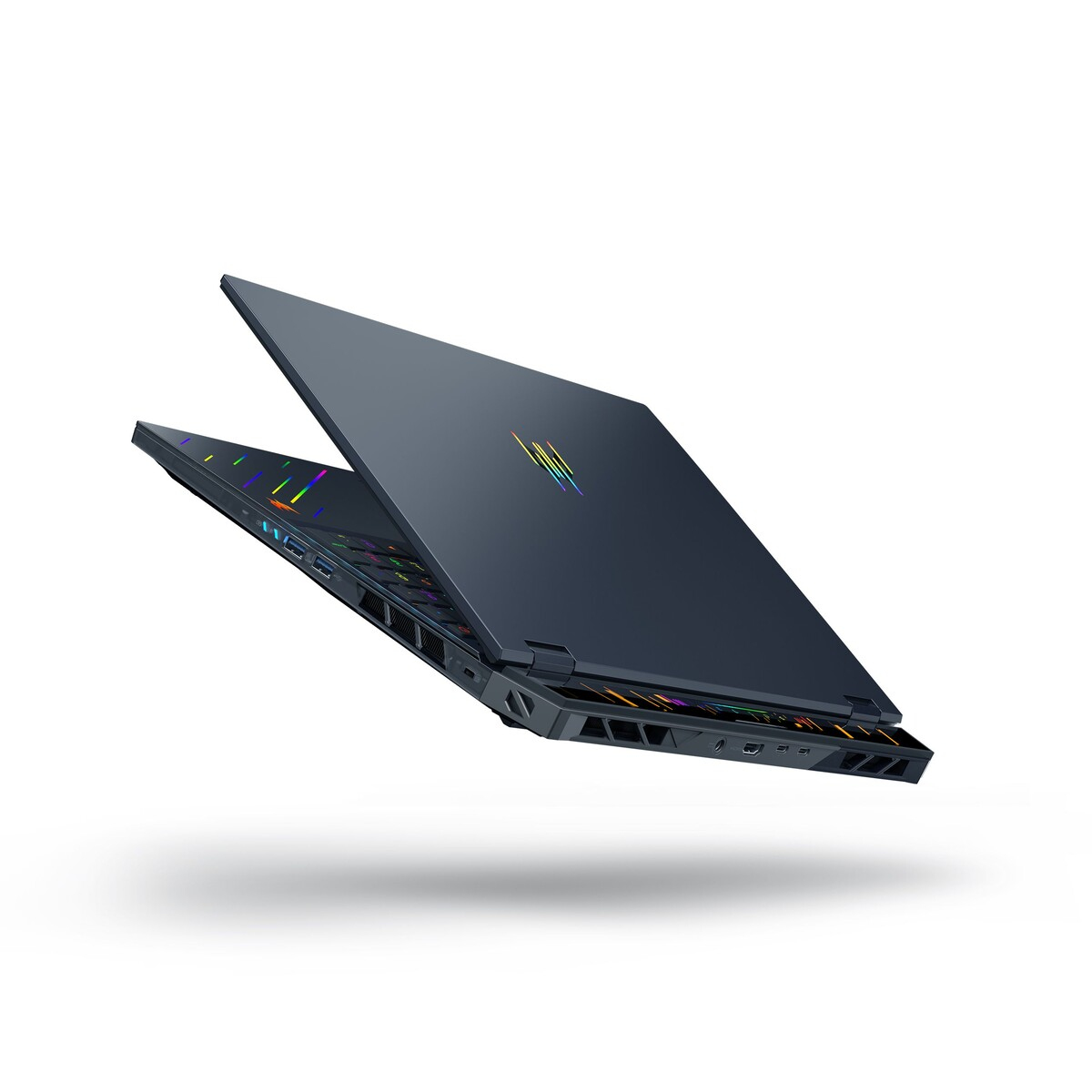 Dark laptop, open, floating. Keyboard visible. Background is white.