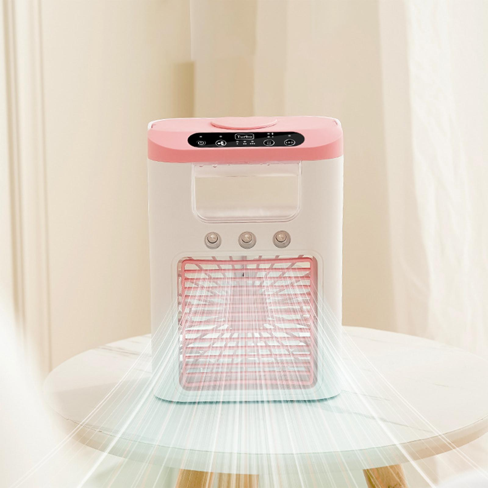 Ein rosa und weißer Klimaanlage auf einem Tisch. Die Vorderseite hat Lüftungsschlitze. Die Oberseite hat Bedienelemente. Lichter gehen aus.