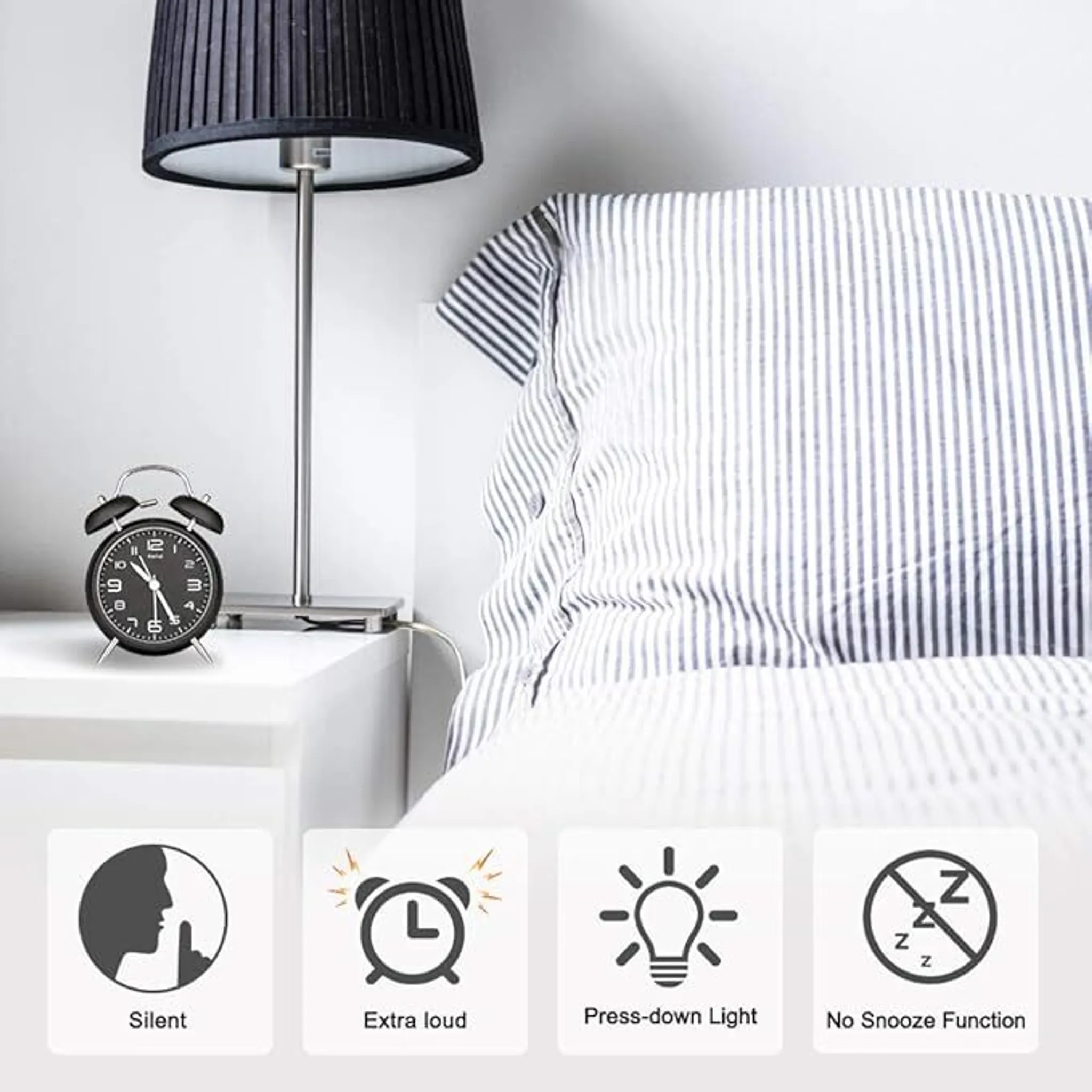 Ein schwarzer Wecker, eine Lampe und ein Bett. Symbole für still, laut, Licht und ohne Schlummerfunktion.