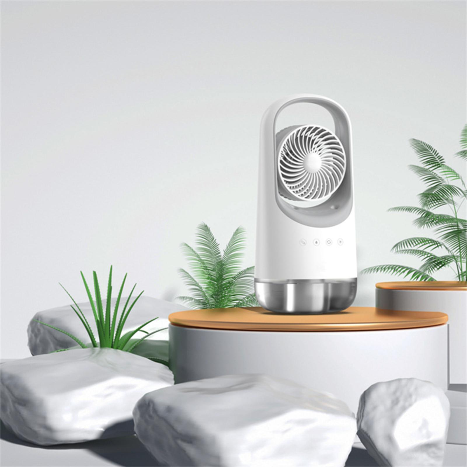 Weißer und silberner moderner Ventilator mit silbernem Sockel, auf einer weißen Plattform mit Steinen.