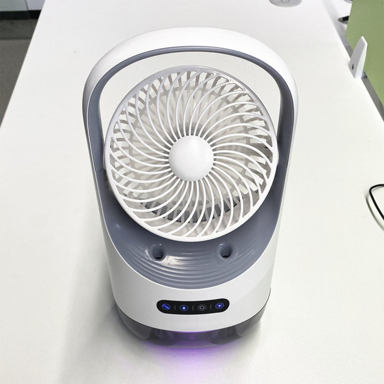 Weiß-grauer tragbarer Luftkühler-Ventilator auf weißer Oberfläche, Draufsicht.