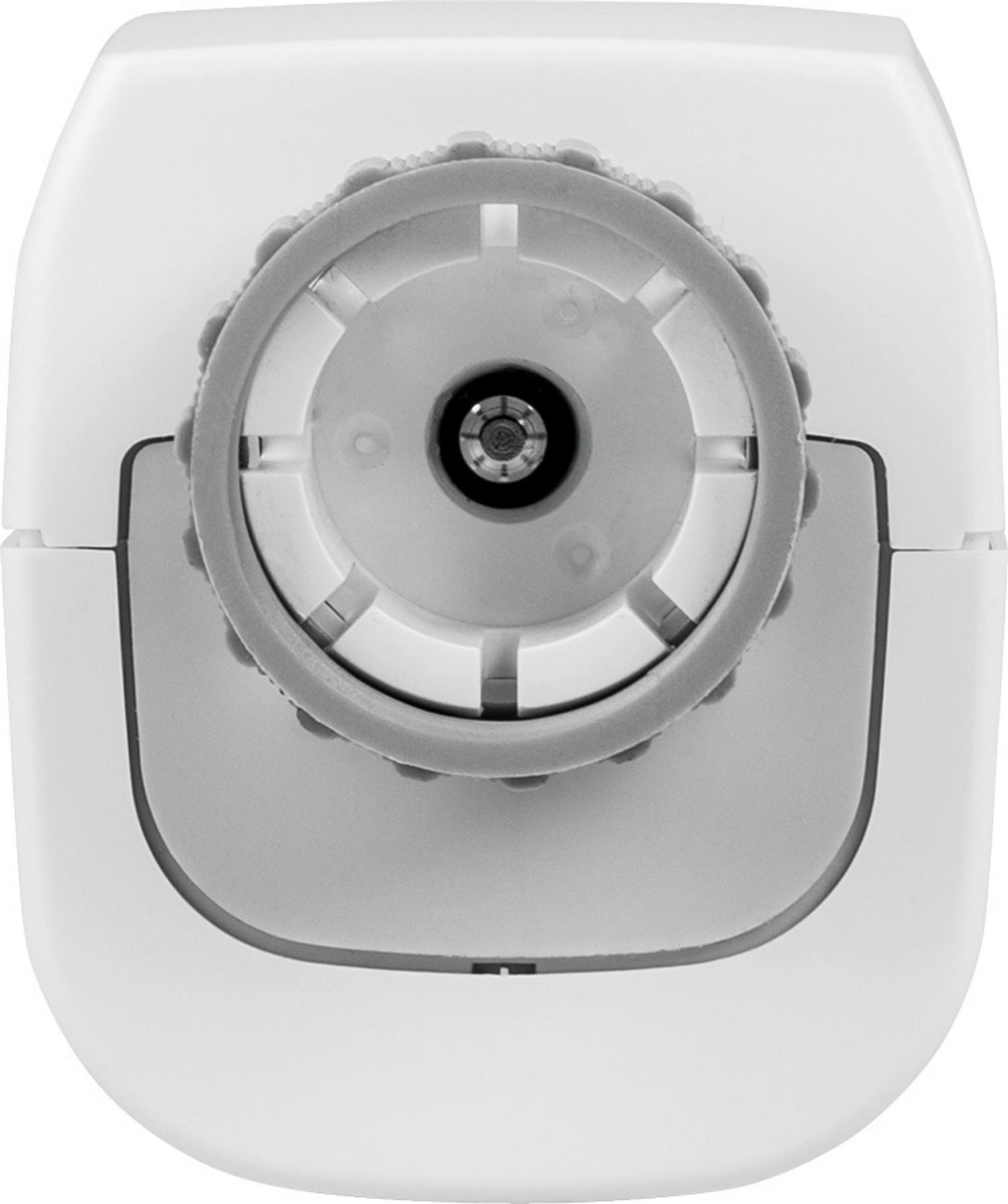 Draufsicht auf ein weißes Gerät mit einer grauen radähnlichen Struktur in der Mitte. Das Gerät ist oval geformt.