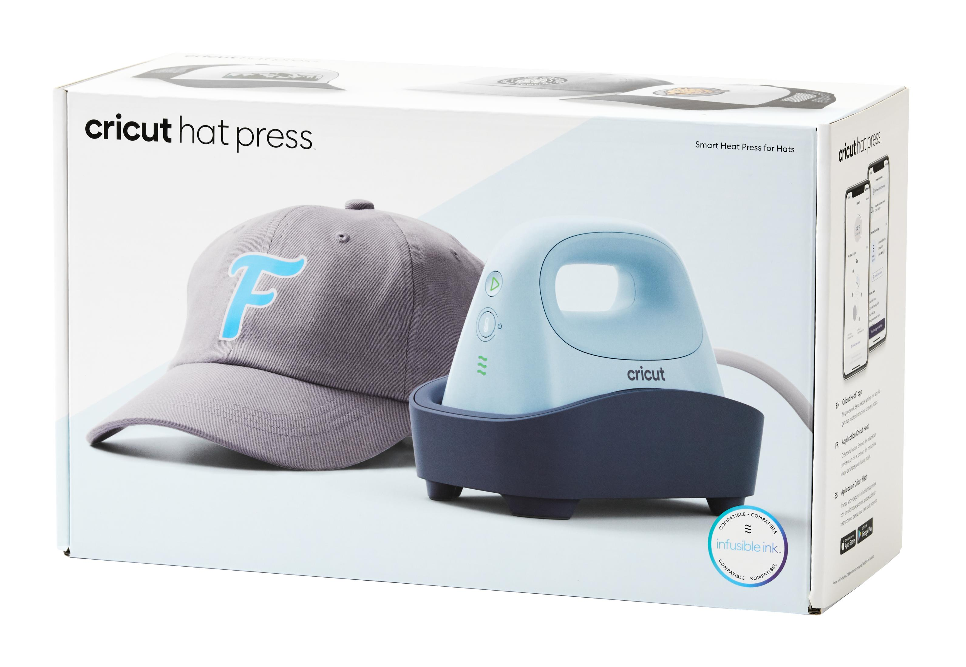 Una macchina Cricut per pressare cappelli e un cappello in una scatola.