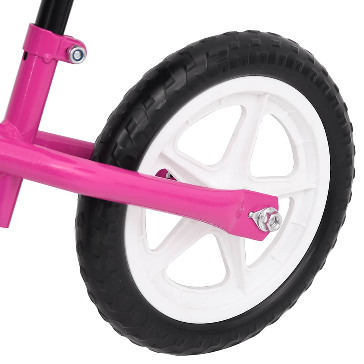 Nahaufnahme eines rosa Laufradrads. Das Rad ist weiß mit einem schwarzen Reifen. Der Rahmen ist rosa.