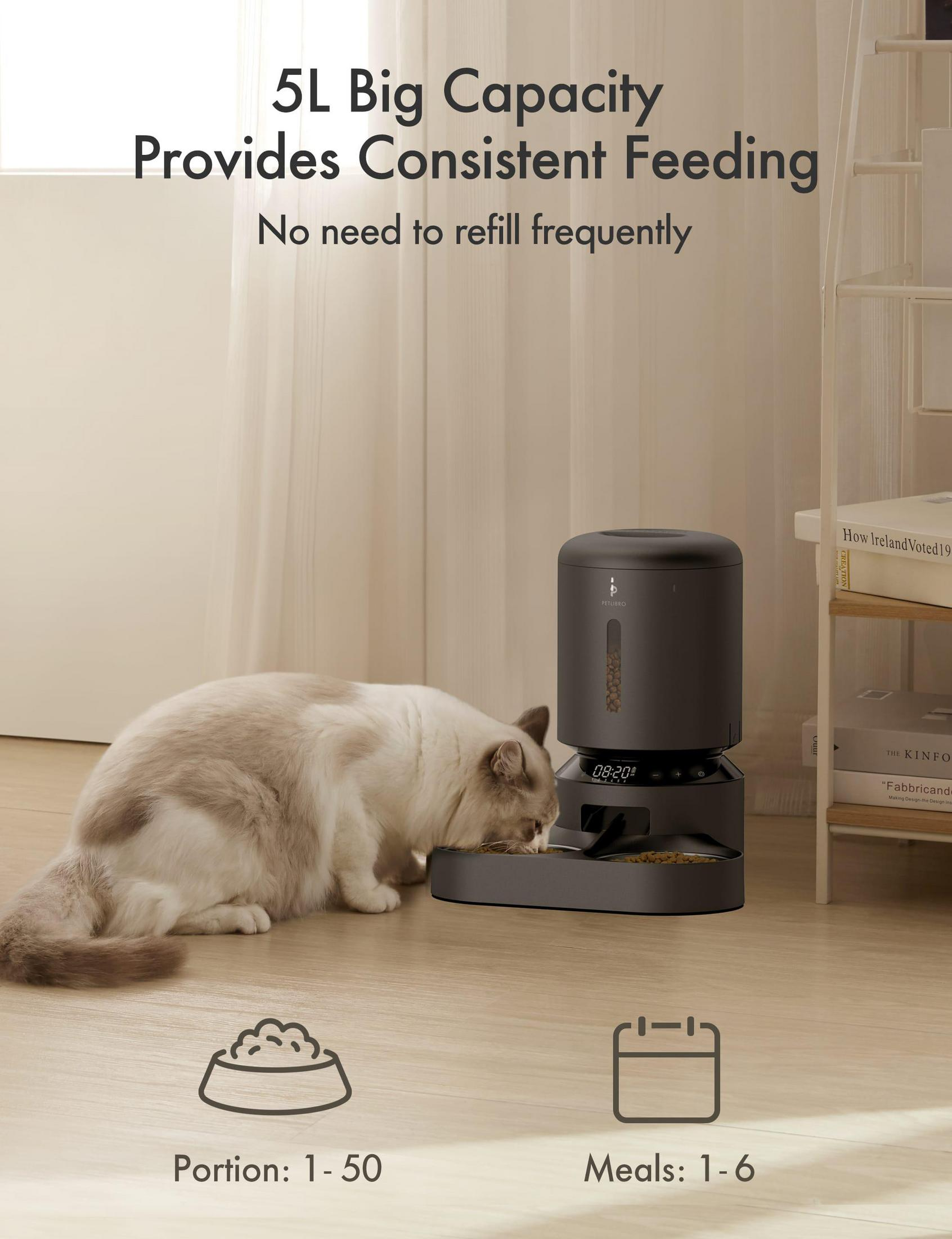 A cat eating from a dark gray automatic pet feeder. Text says 5L capacity, provides consistent feeding. 