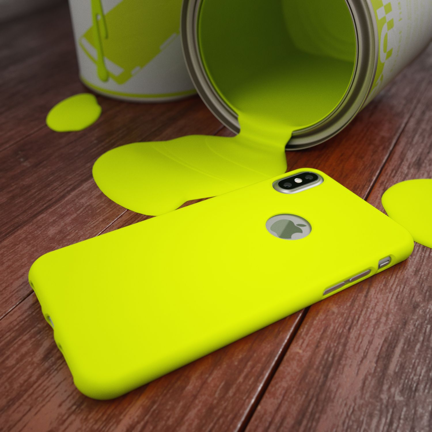 Custodia gialla per telefono su superficie di legno, vernice verde versata. Logo Apple visibile.