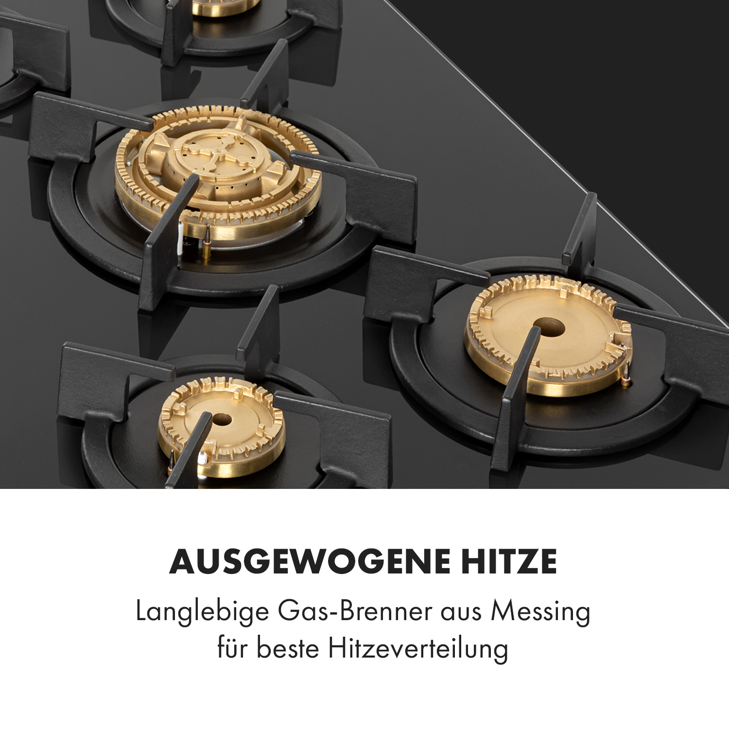 Nahaufnahme eines Gasherds mit schwarzen Brennern und goldfarbenen Brennerköpfen, mit Text zur Wärmeverteilung.