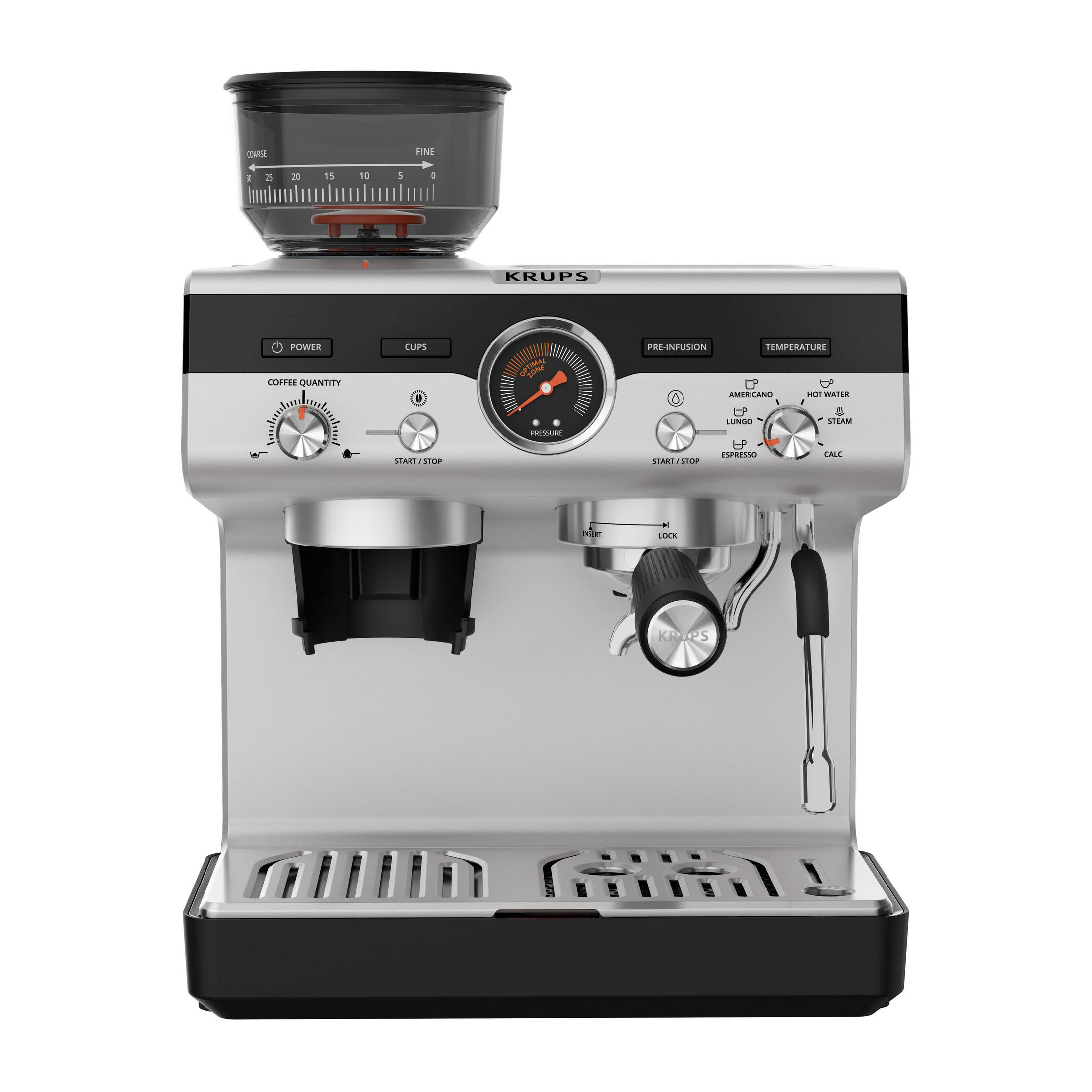 Srebrny ekspres do kawy z ziarnami kawy w górnym pojemniku. Widoczny manometr i przyciski sterowania.