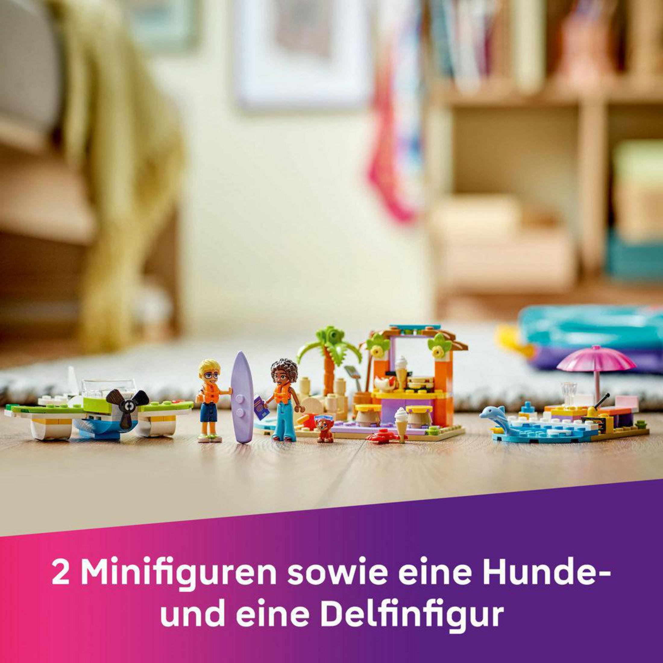 Set de Lego Friends con dos figuras, un perro y un delfín sobre una mesa.