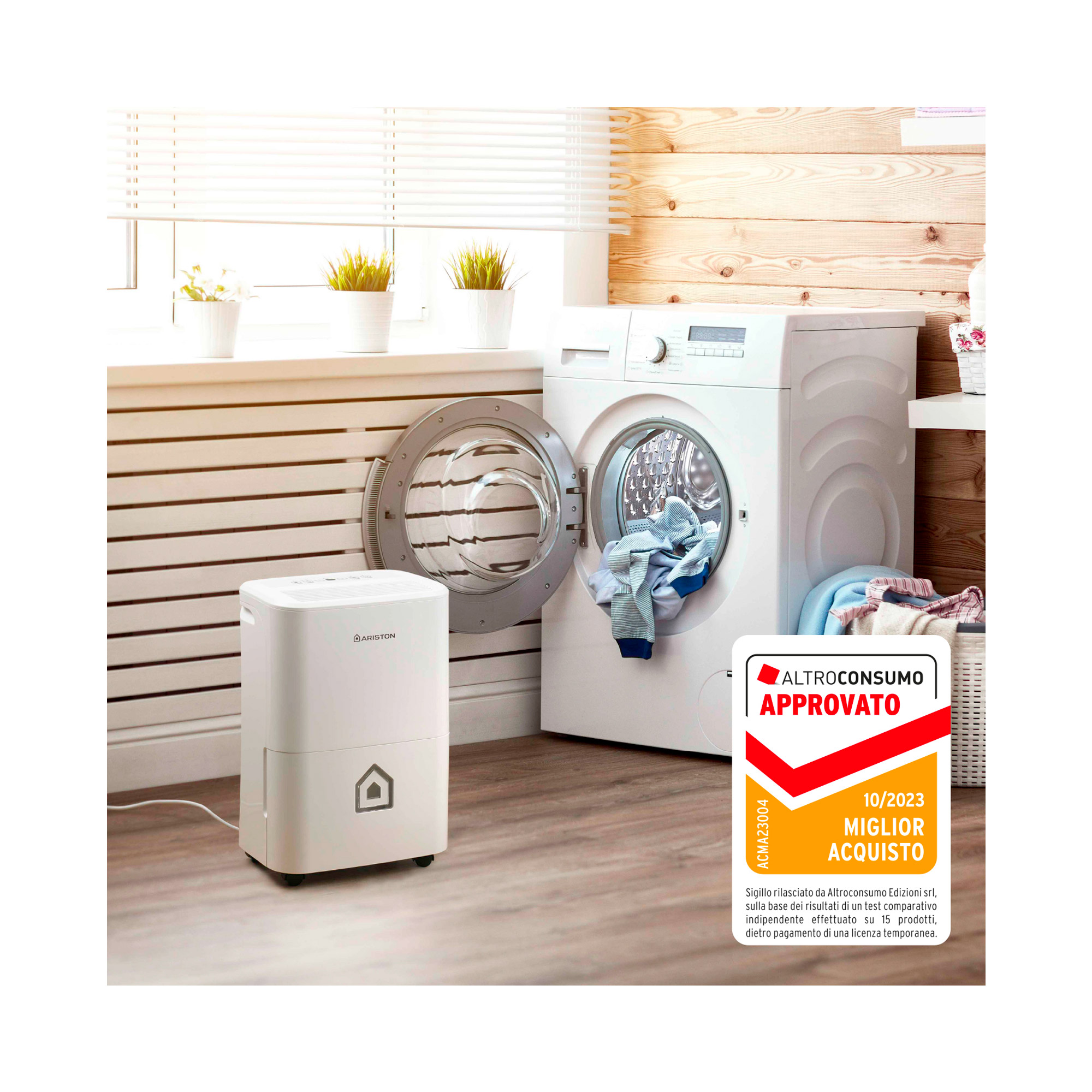 Een witte luchtontvochtiger, een wasmachine met open deur en een wasruimte.