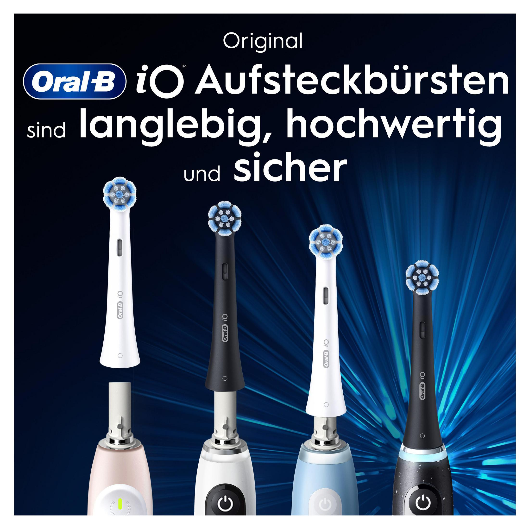 Mehrere Oral-B iO-Bürstenköpfe in Weiß, Schwarz und Blau. Text besagt, dass sie haltbar sind.