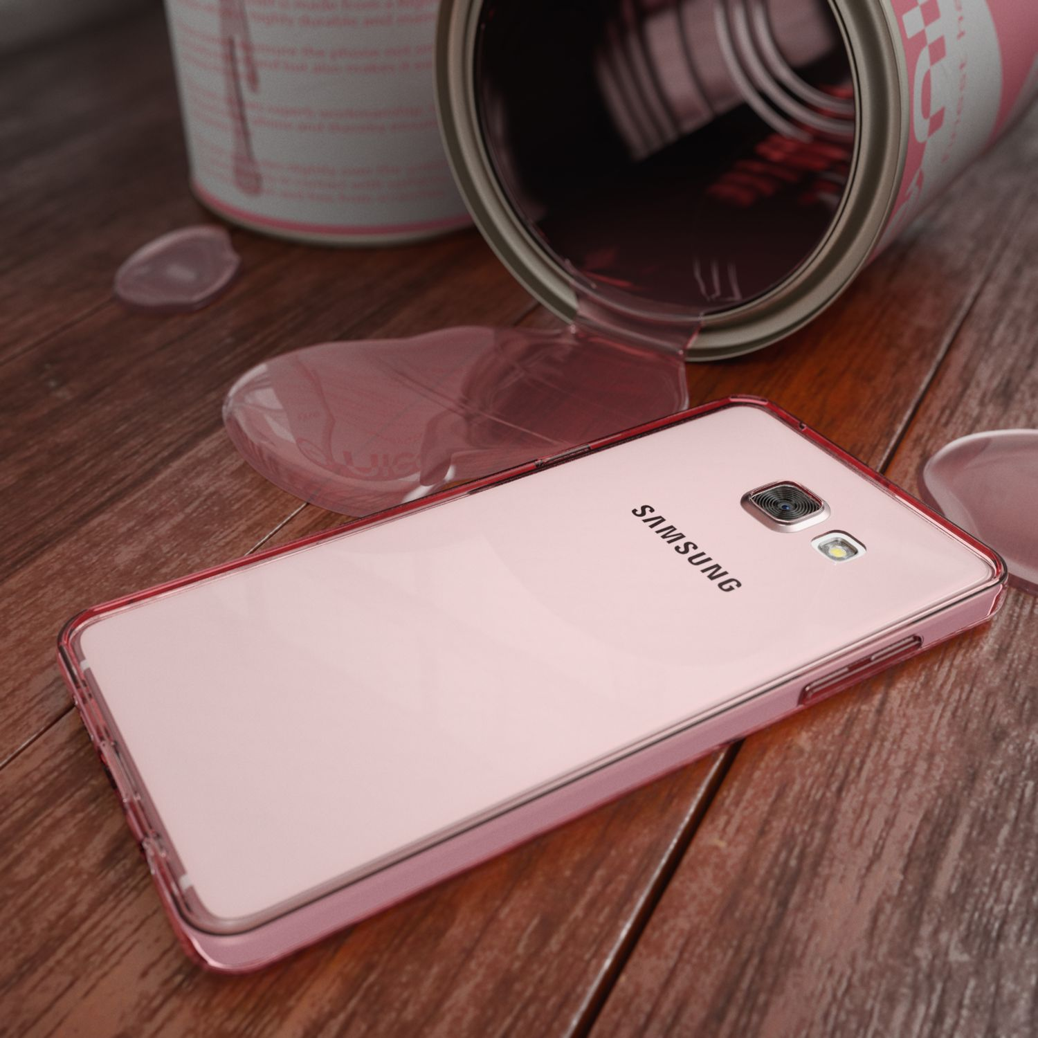 Rosa Samsung-Telefon, verschüttete rosa Farbe und eine Farbdose auf Holzoberfläche.