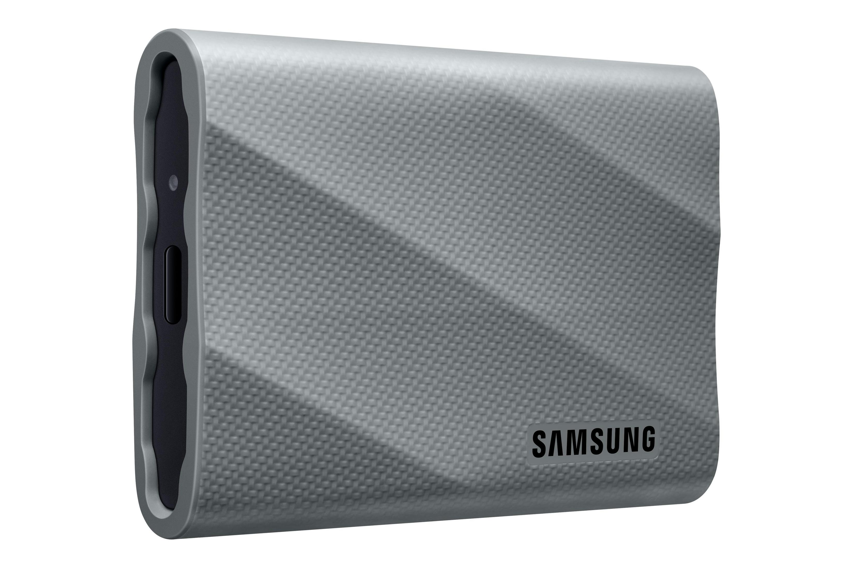 Un SSD portatile Samsung grigio con il nome del marchio in basso.