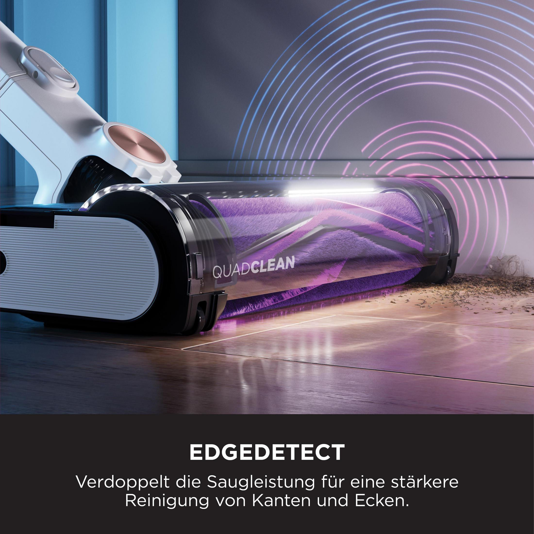 Vacuum cleaner on wood floor, purple roller, white and black body, edge detect feature, light trails.