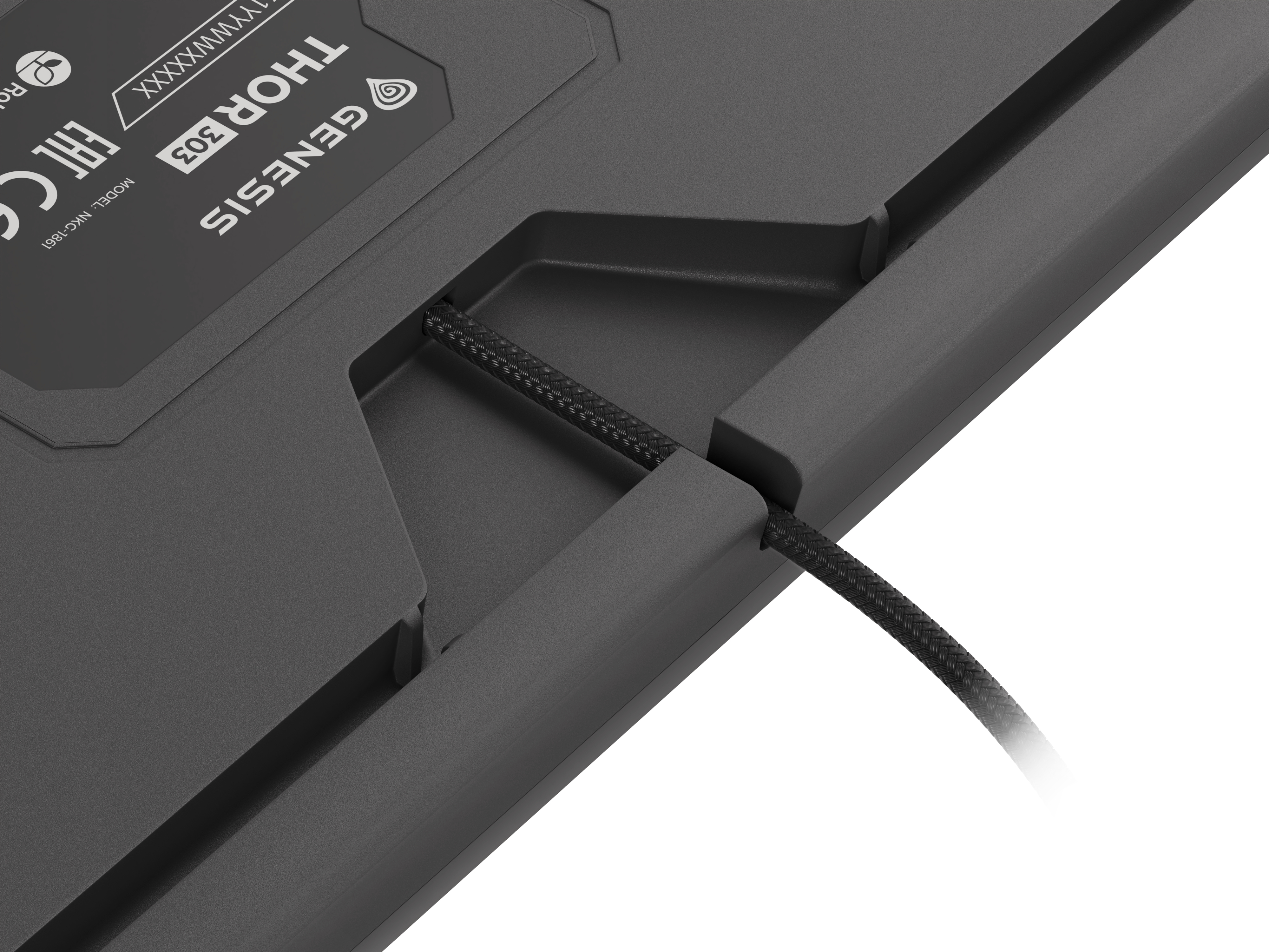 The underside of a keyboard. You can see the Genesis and Thor 303 model names. A cable is attached.
