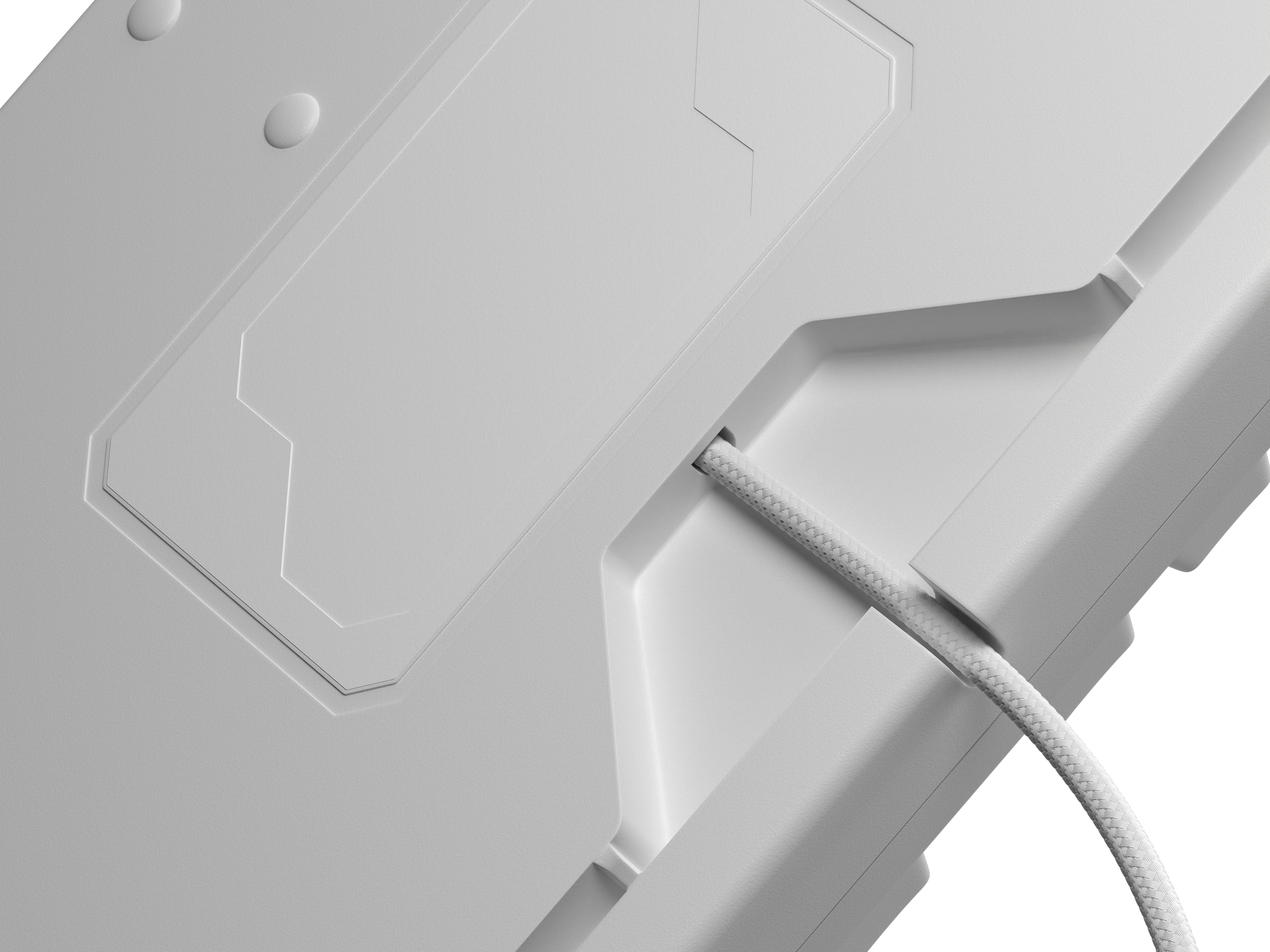 Szczegół spodu białej klawiatury z przewodem i wzorem.