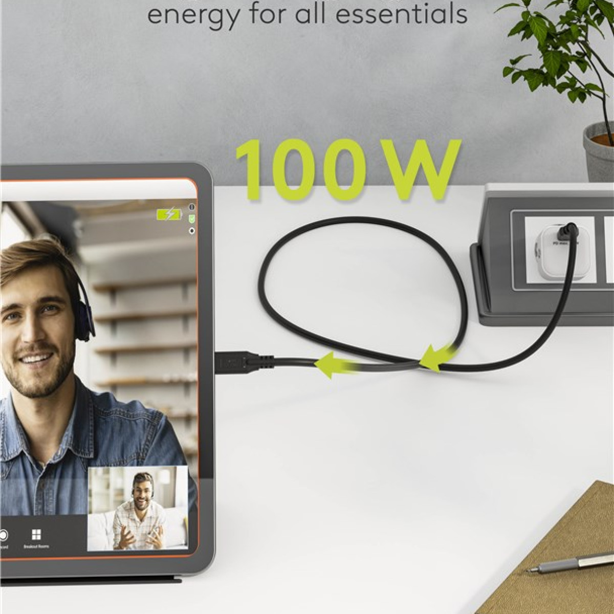 Tablet sul tavolo con videochiamata, cavo collegato, testo 100W.