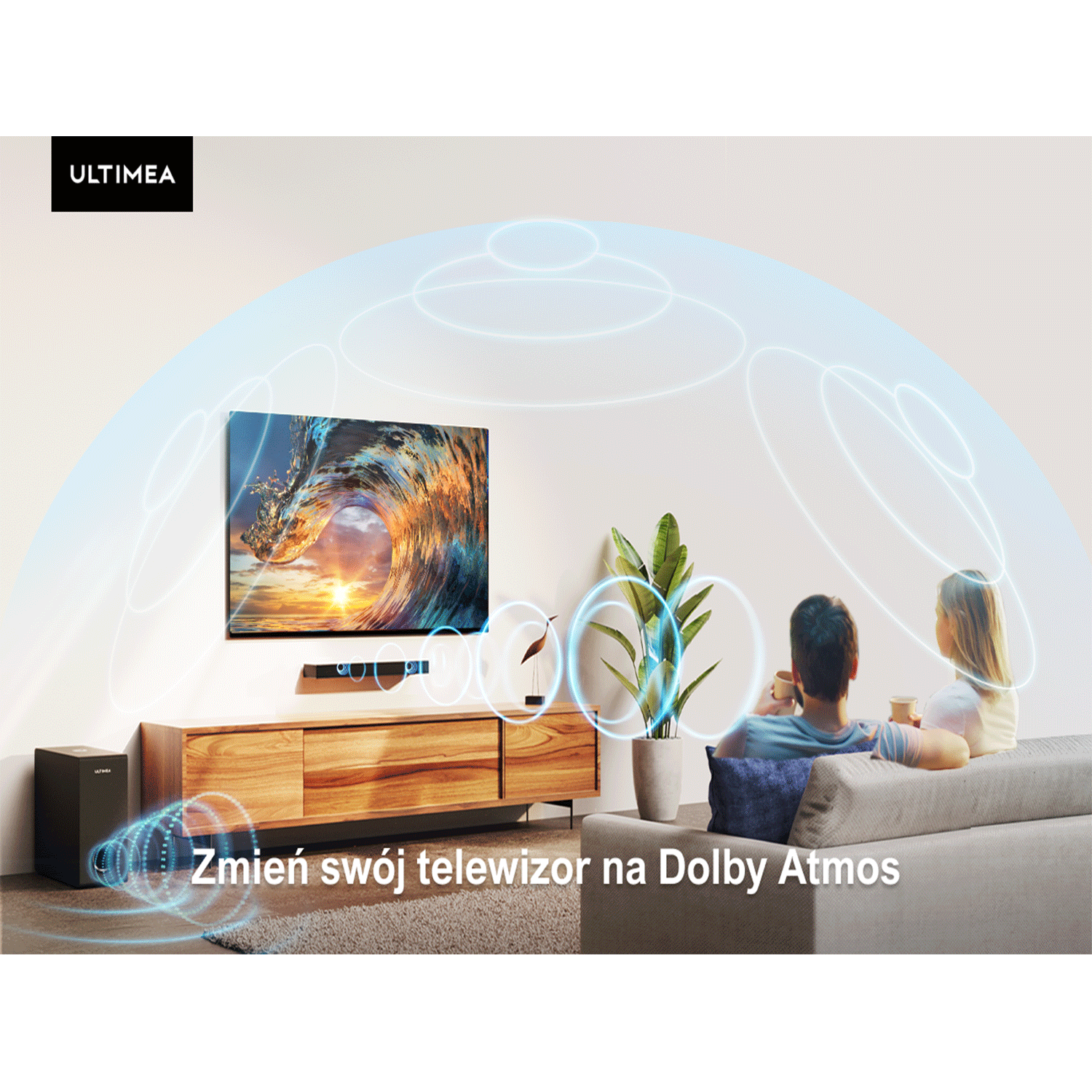 Ustawienie salonu z telewizorem, soundbarem i subwooferem, z parą na sofie.