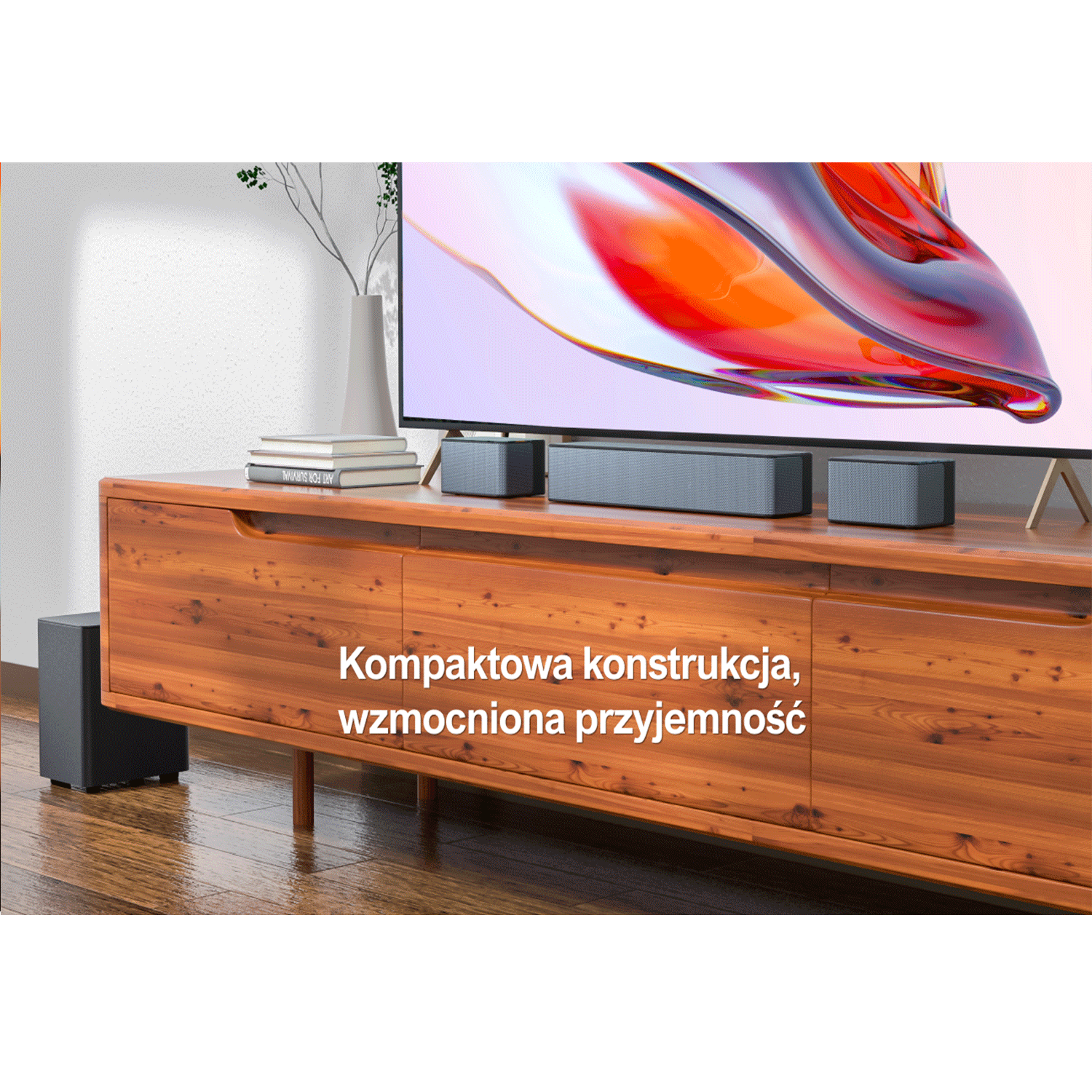 Telewizor z głośnikami dźwięku przestrzennego i subwooferem. Tekst: Kompaktowa konstrukcja, wzmocniona przyjemność.
