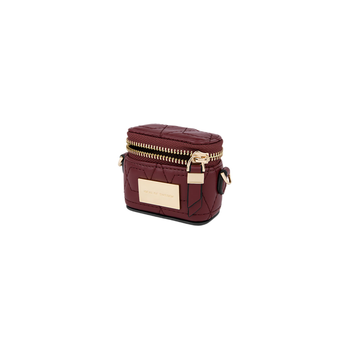 Funda burdeos con cremallera, detalles dorados y la marca Ideal of Sweden.