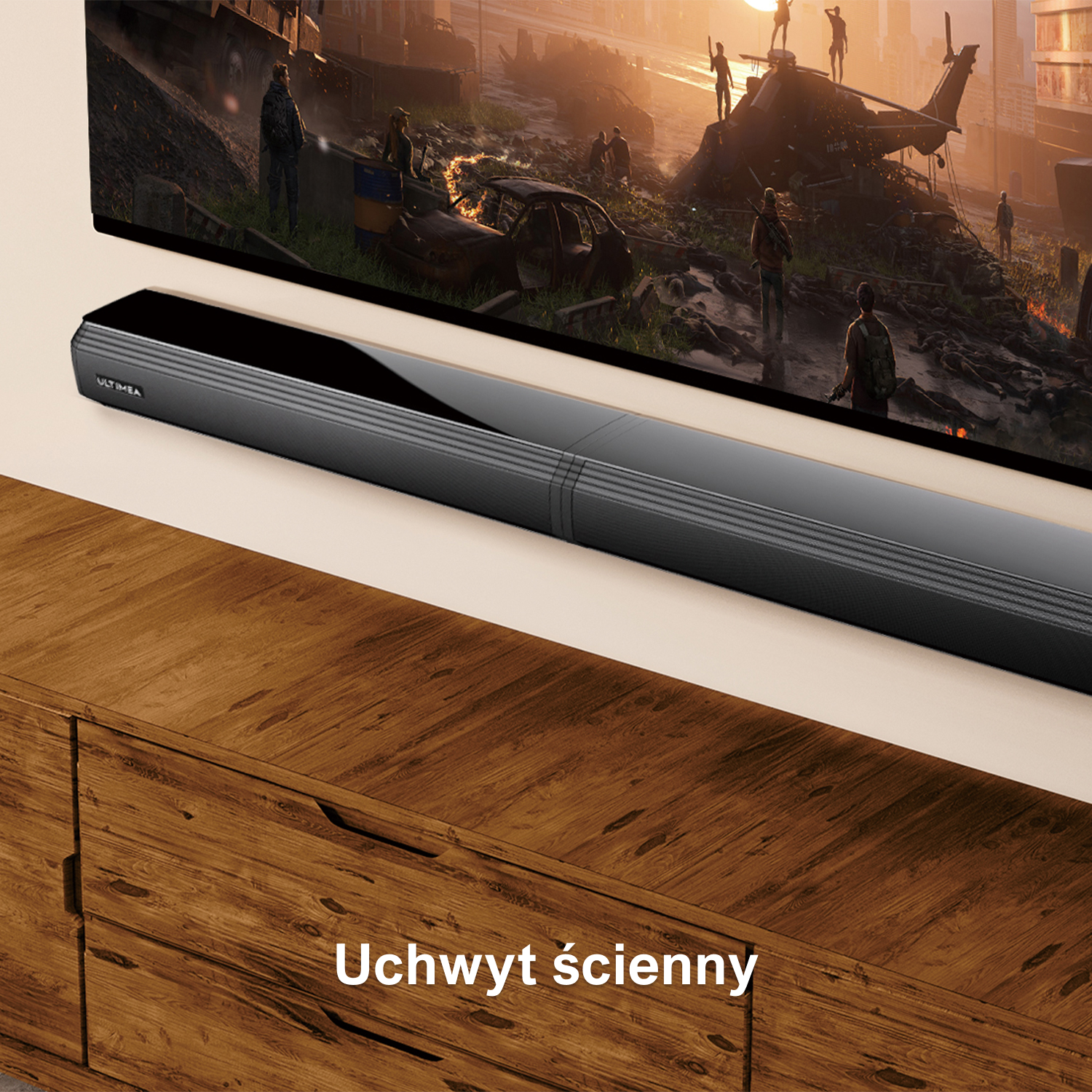 Soundbar zamontowany pod telewizorem. Drewniana szafka pod spodem.