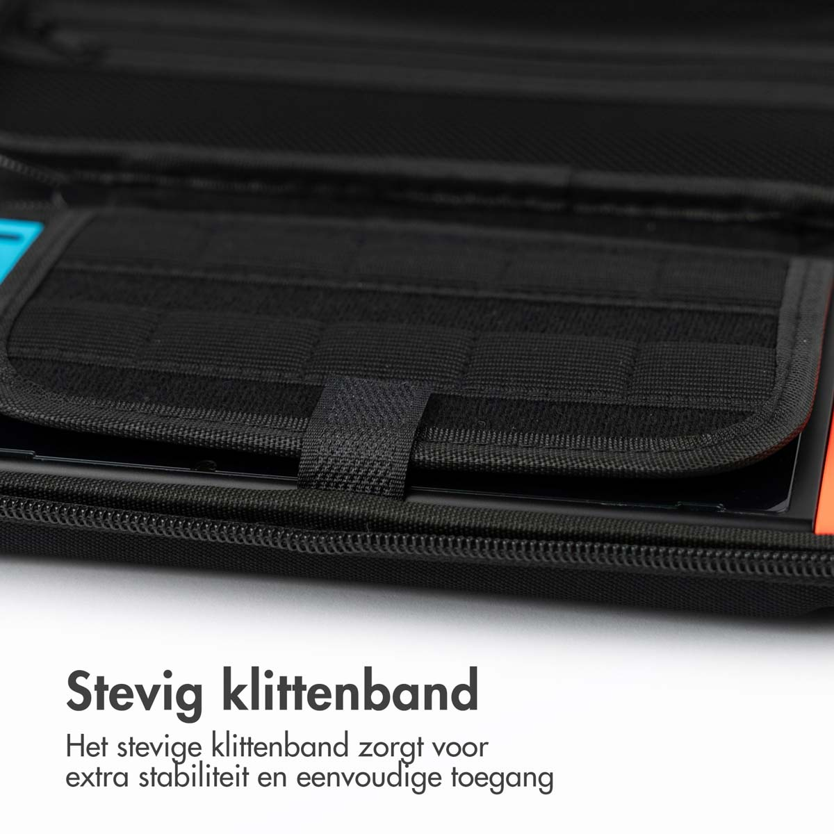 Close-up of black velcro strap inside a black case, with a black pocket below.