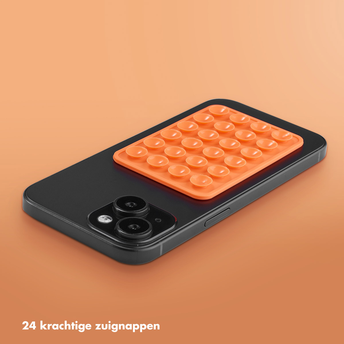Zwarte telefoon met oranje zuignap. Oranje zuignap met meerdere zuignappen.