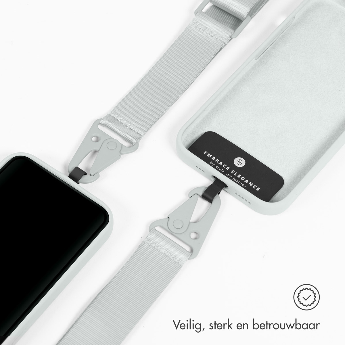 Custodia per telefono con cinturino grigio e clip metalliche su sfondo grigio chiaro.