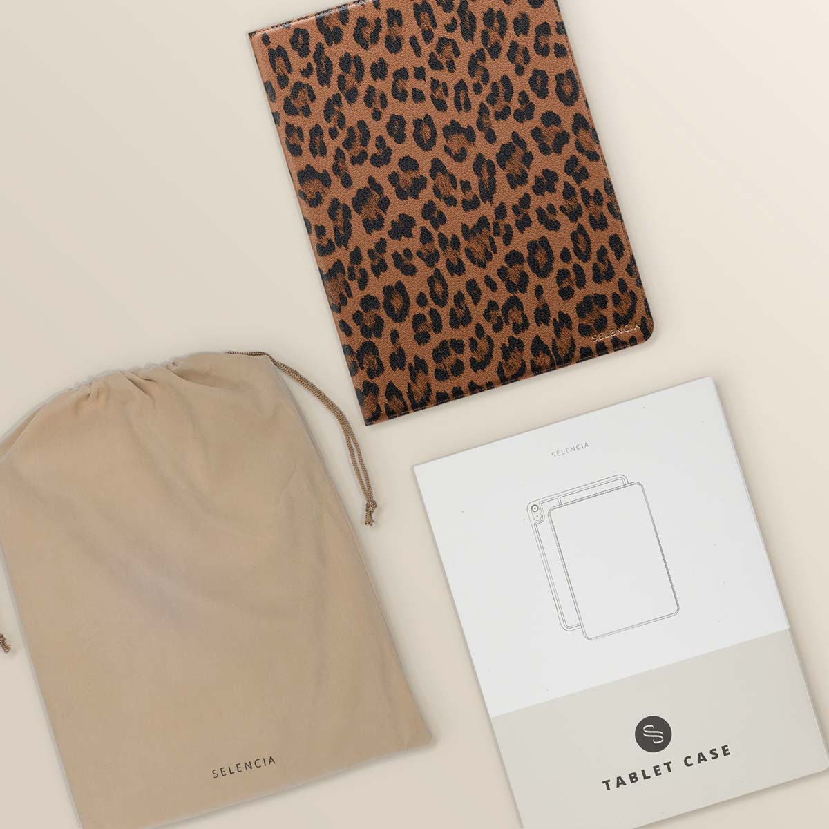 Tablet case, bag and information sheet. Leopard print on the case.