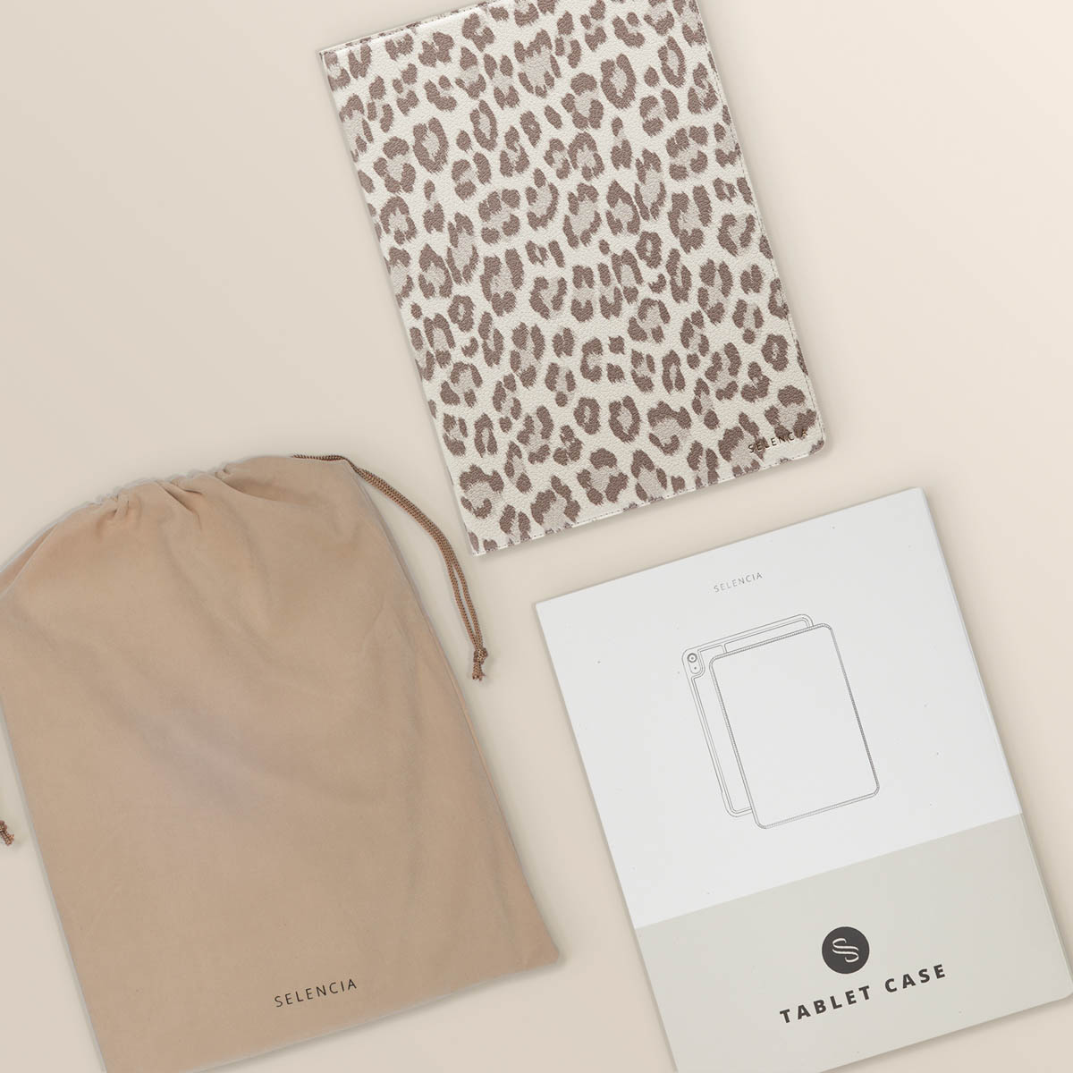 Tablet case with a drawstring bag and packaging. Leopard print on the case, the bag is beige.