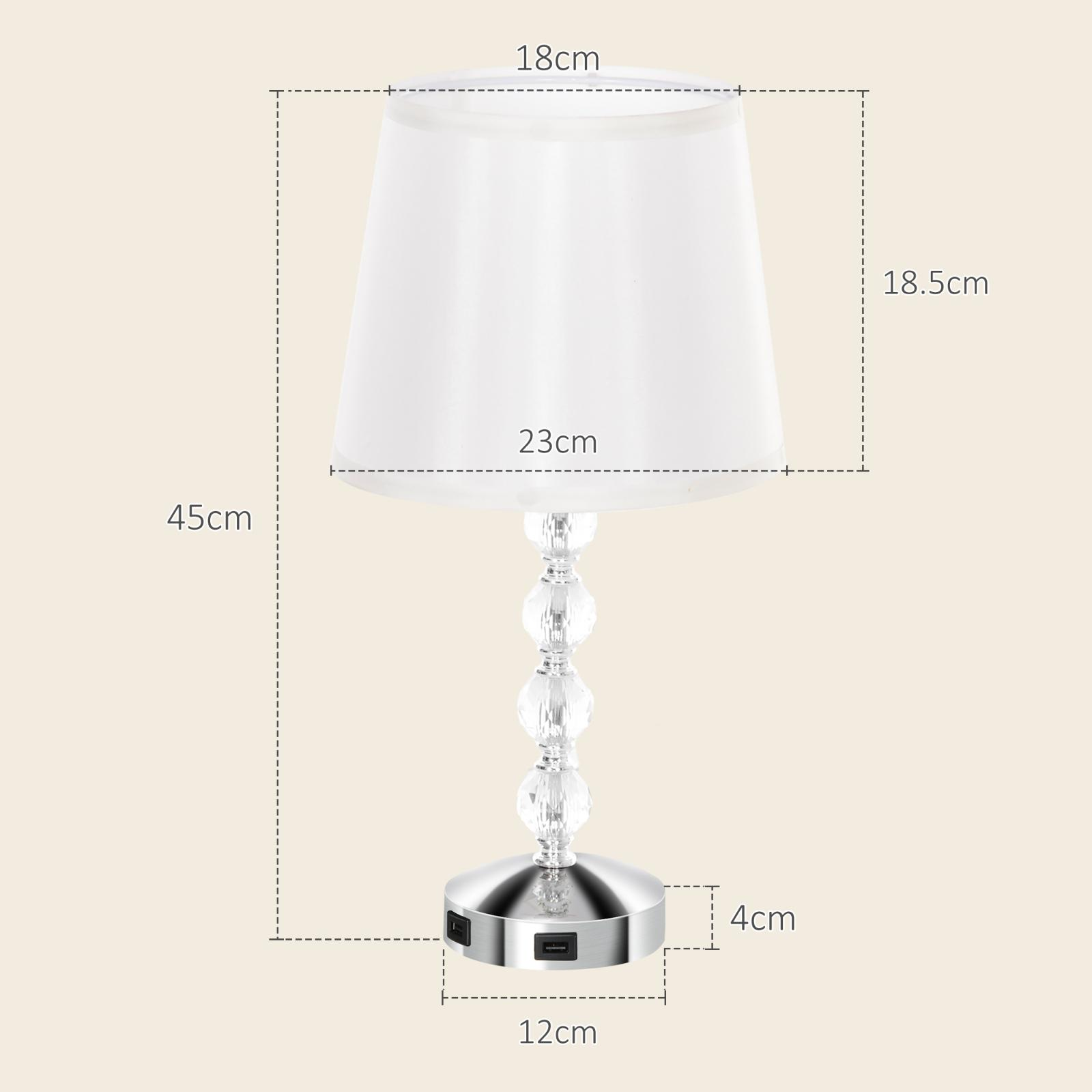 Tischlampe mit weißem Schirm, Kristallfuß, Abmessungen in cm. Weißer Hintergrund.