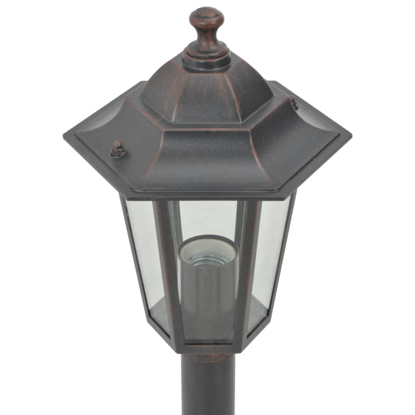 Schwarze und bronzefarbene Außenlaterne mit Glasgehäuse und dekorativer Spitze.