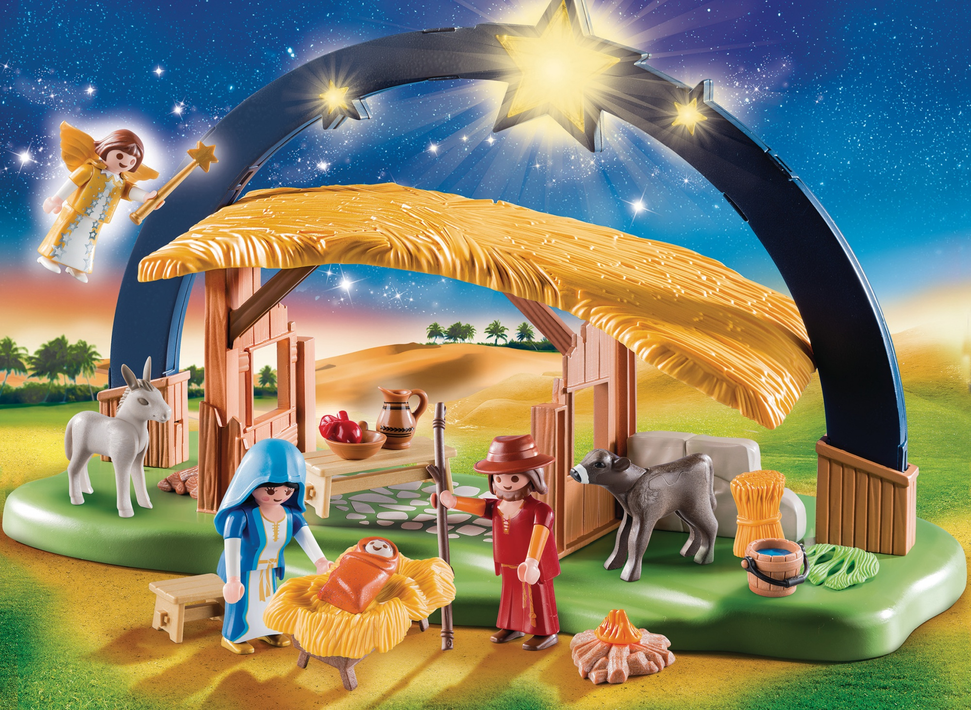 Presepe Playmobil con statuine, una stalla e uno sfondo stellato.