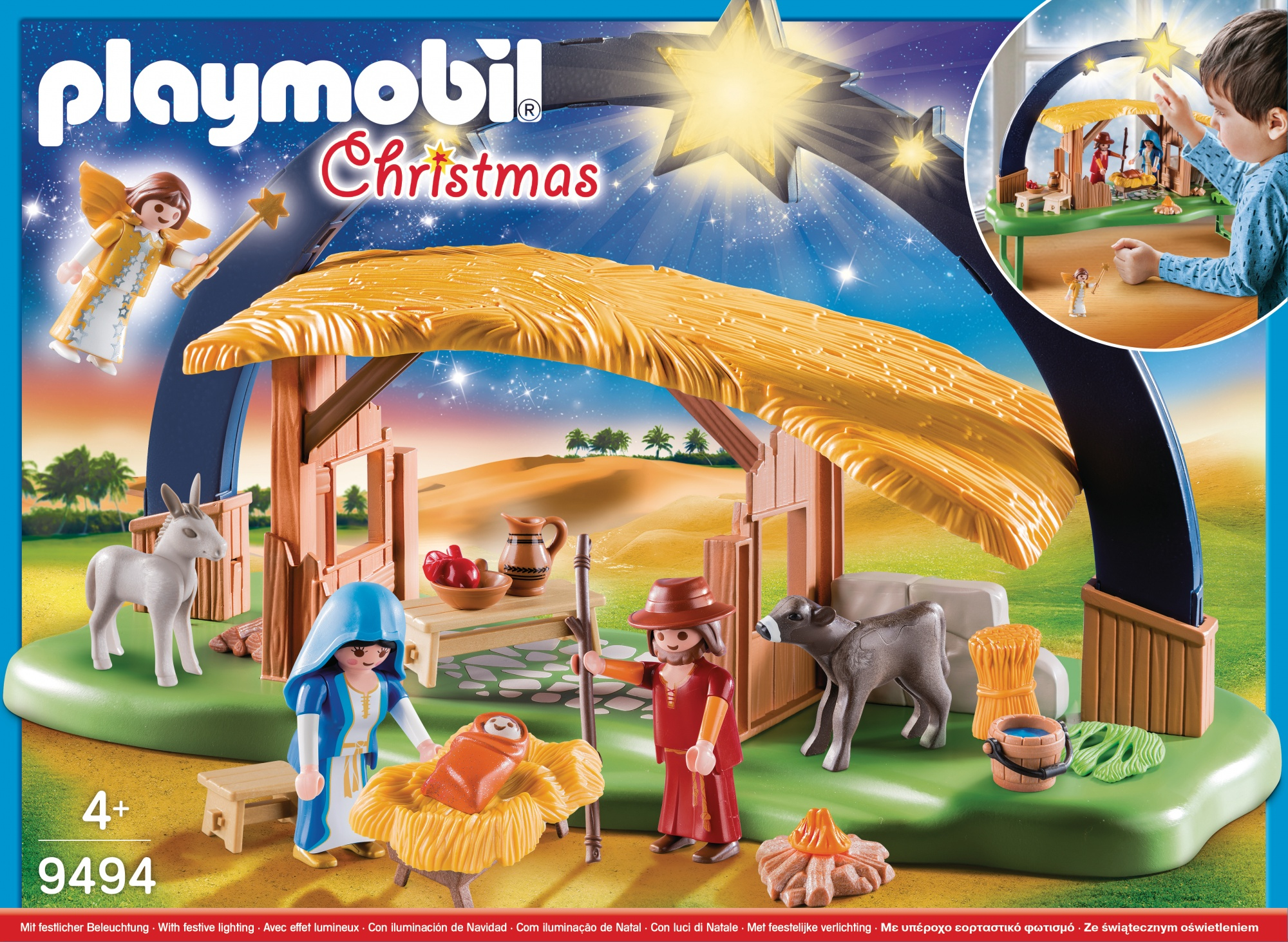 Scena del presepe di Natale Playmobil in una scatola, con personaggi e una stella sopra.