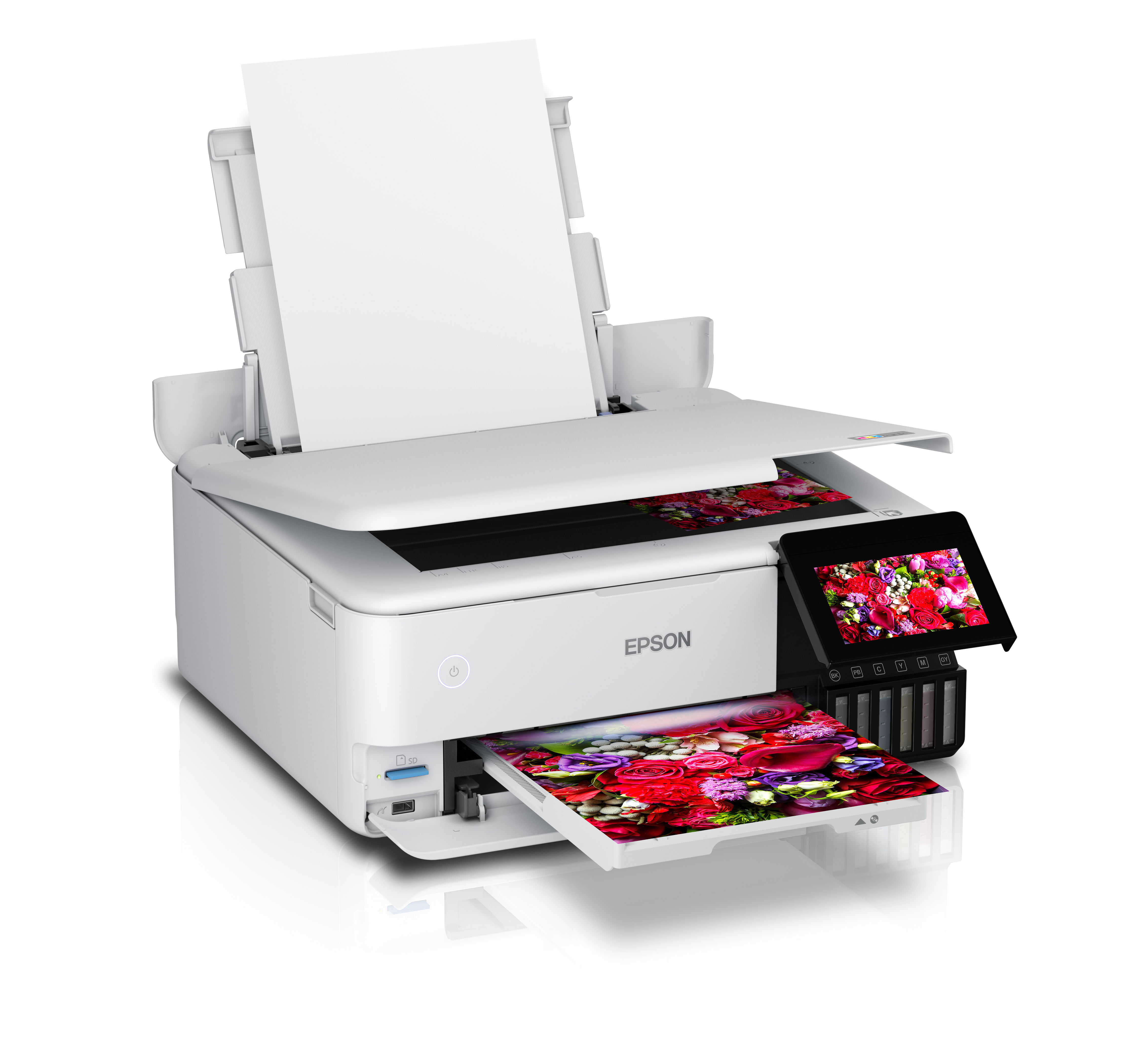 Imprimante Epson en train d'imprimer. Le papier sort. Des fleurs sont imprimées sur le papier de sortie. Réservoirs d'encre visibles.