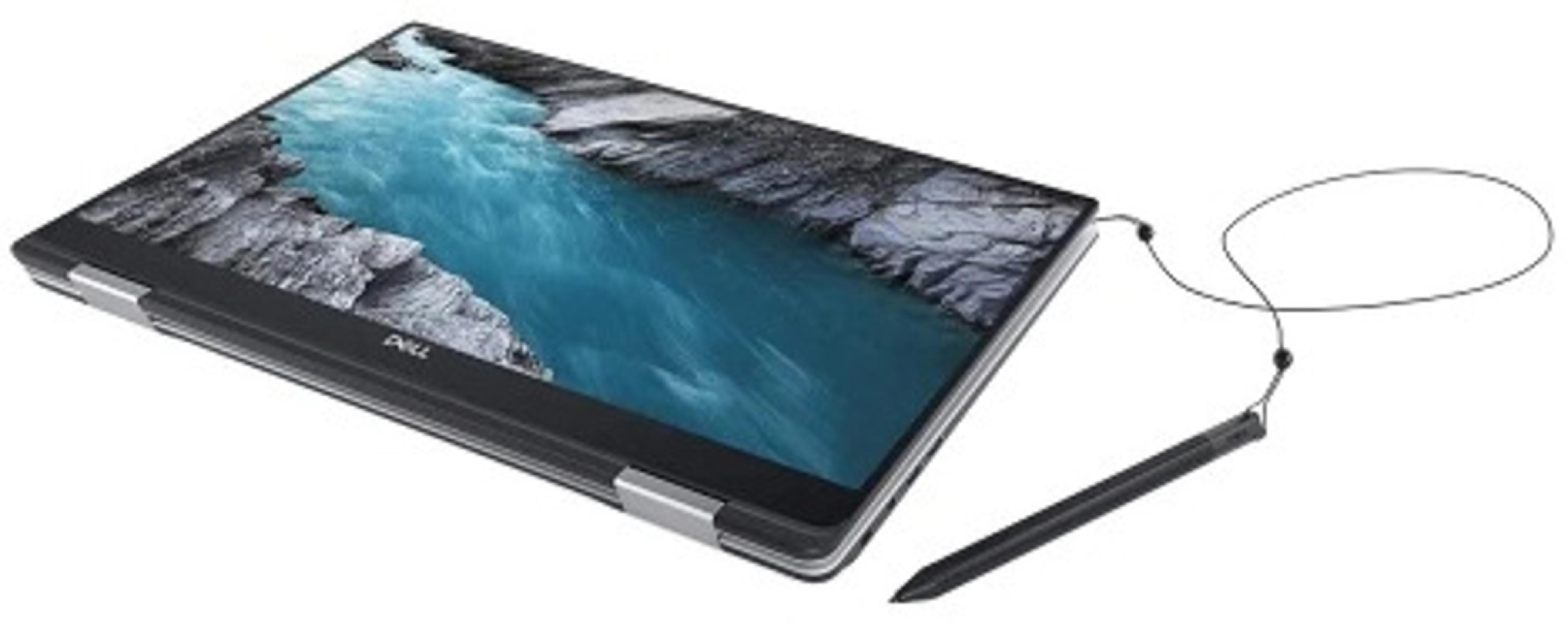 Laptop mit schwarzem Rahmen und Stift. Der Bildschirm zeigt eine malerische Ansicht eines Canyons.