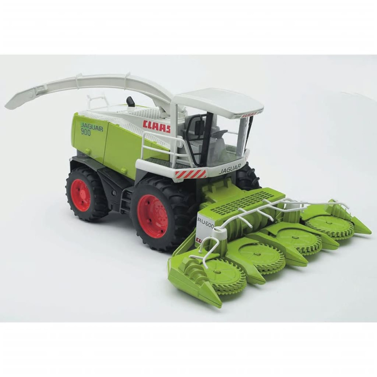 Claas Jaguar 900 zabawka. Zielony i biały z czerwonymi kołami. Białe tło.