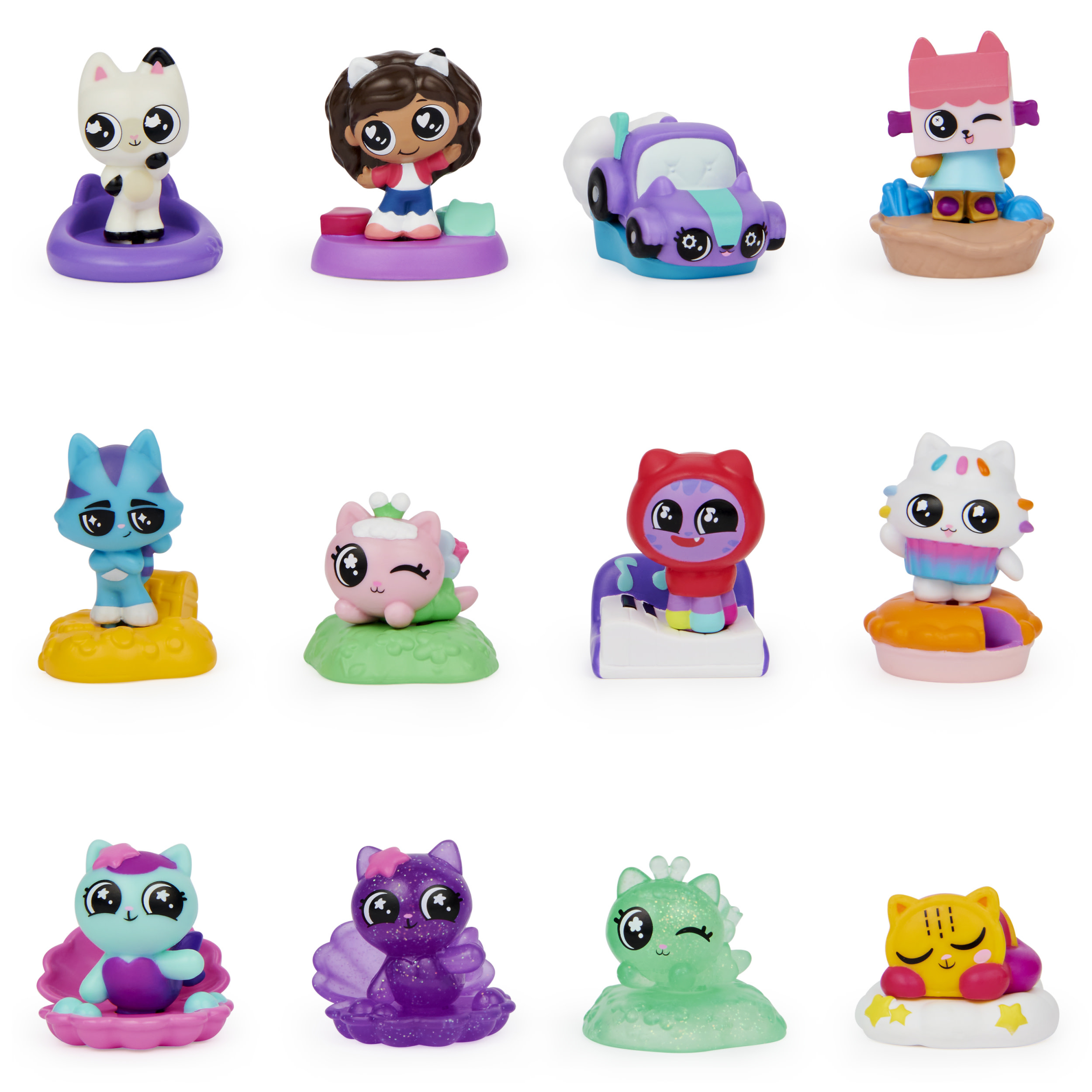 Figurki Gabby's Dollhouse w grupie. Różne figurki z motywem kota w różnych pozach.