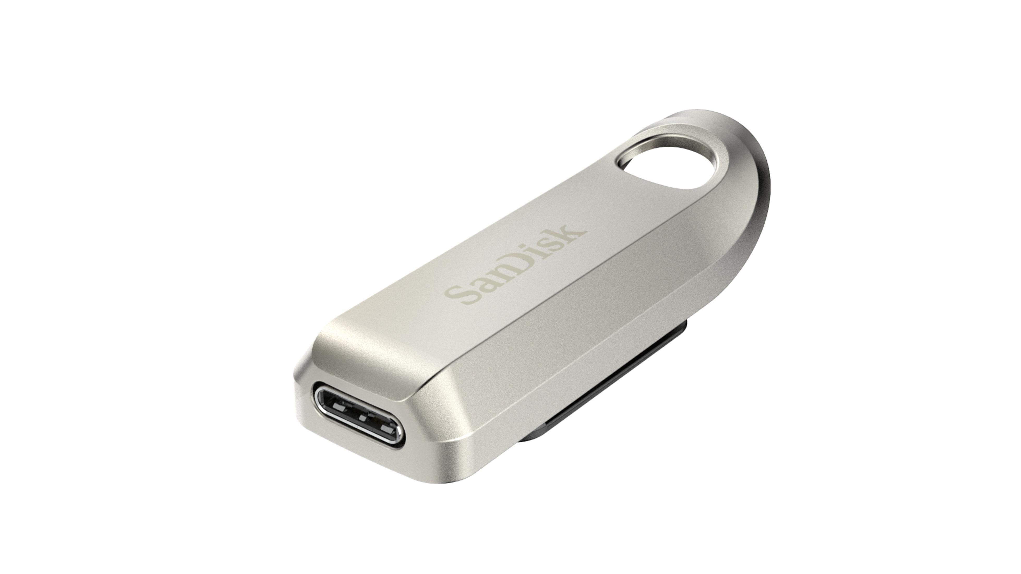 Srebrny pendrive USB-C. Metaliczny kolor, z nadrukowanym logo Sandisk.