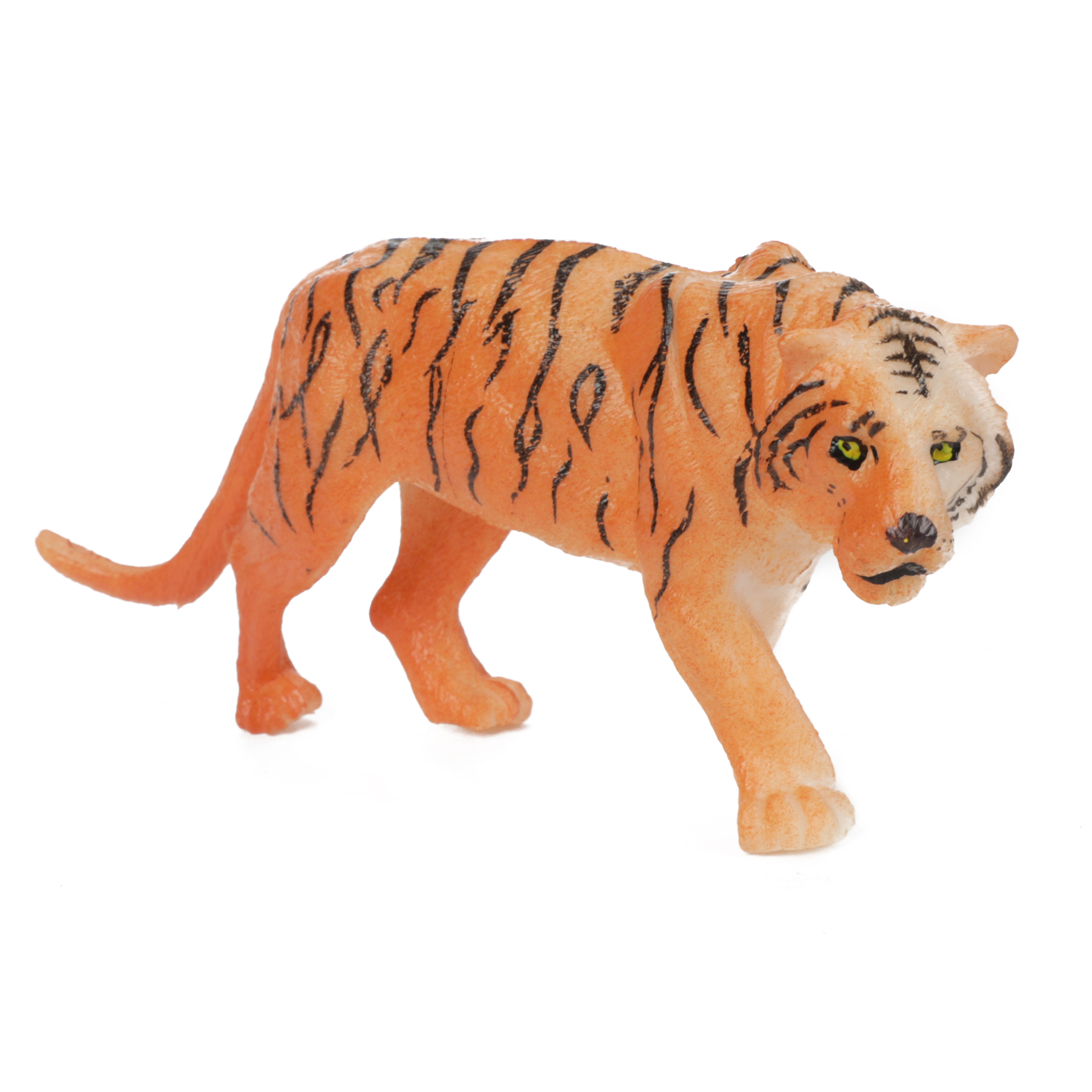 Ein Plastikspielzeugtiger, orange mit schwarzen Streifen, vor weißem Hintergrund.