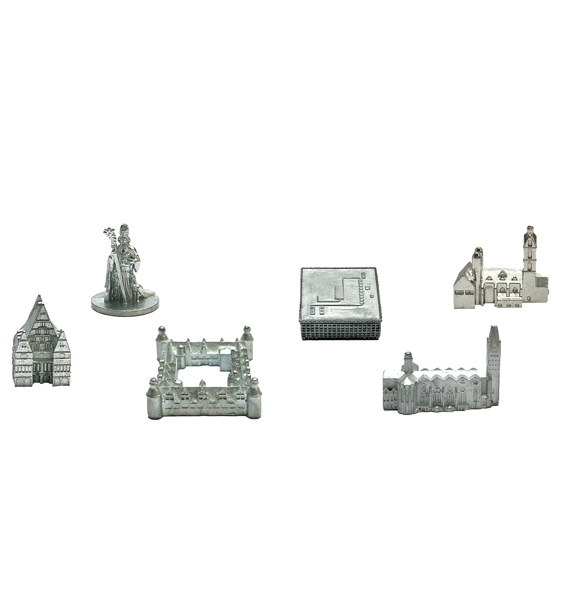 Miniatur-Metallmodelle von Gebäuden, darunter eine Kirche, Statue und andere Strukturen.
