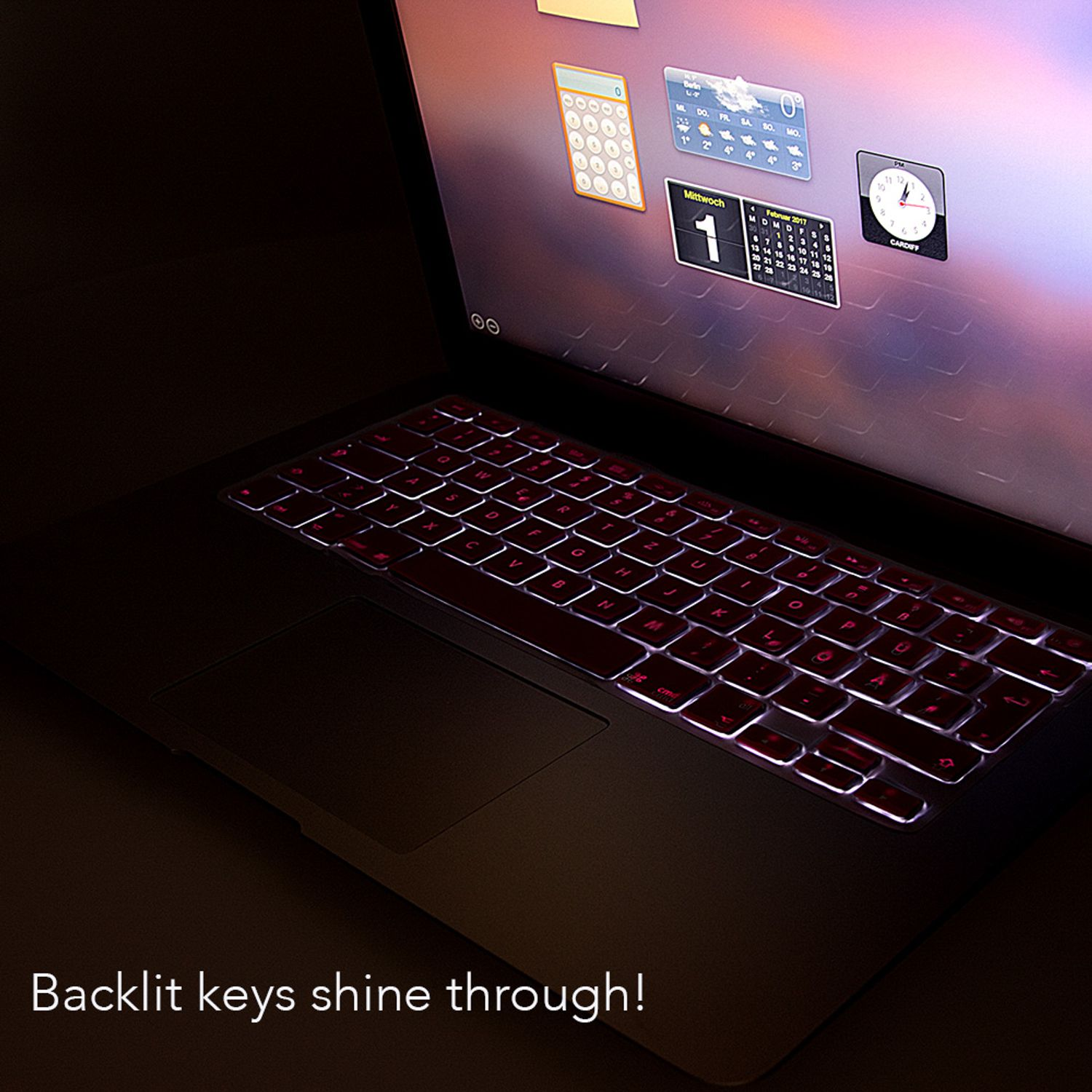 Un clavier d'ordinateur portable avec des touches éclairées. Les touches ont un rétroéclairage rouge.