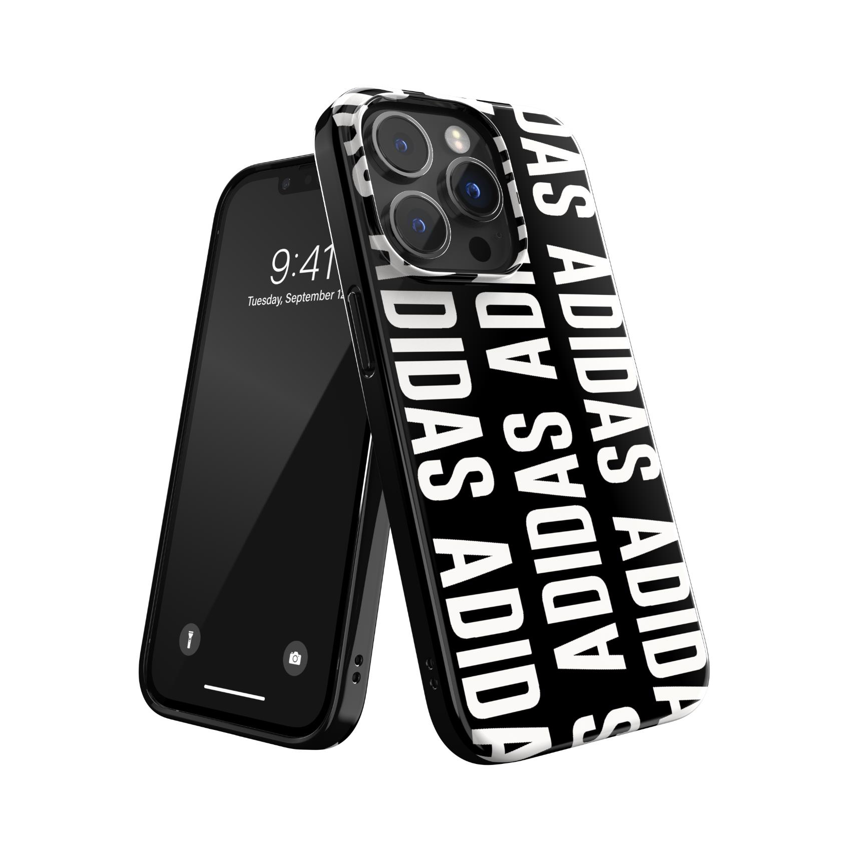 Custodia per telefono Adidas bianca e nera su un telefono nero. Il logo Adidas è ripetuto.