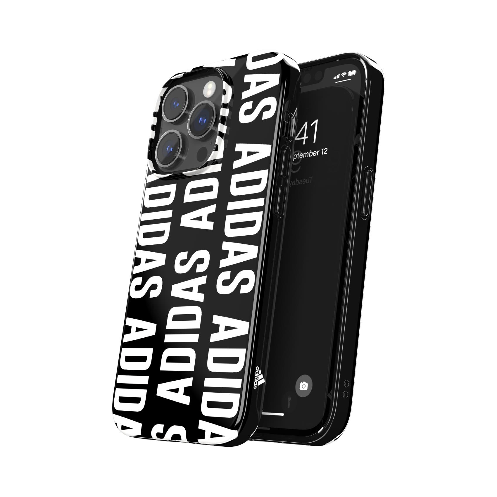 Un telefono nero con una custodia Adidas, con il logo Adidas in bianco, su una superficie bianca.
