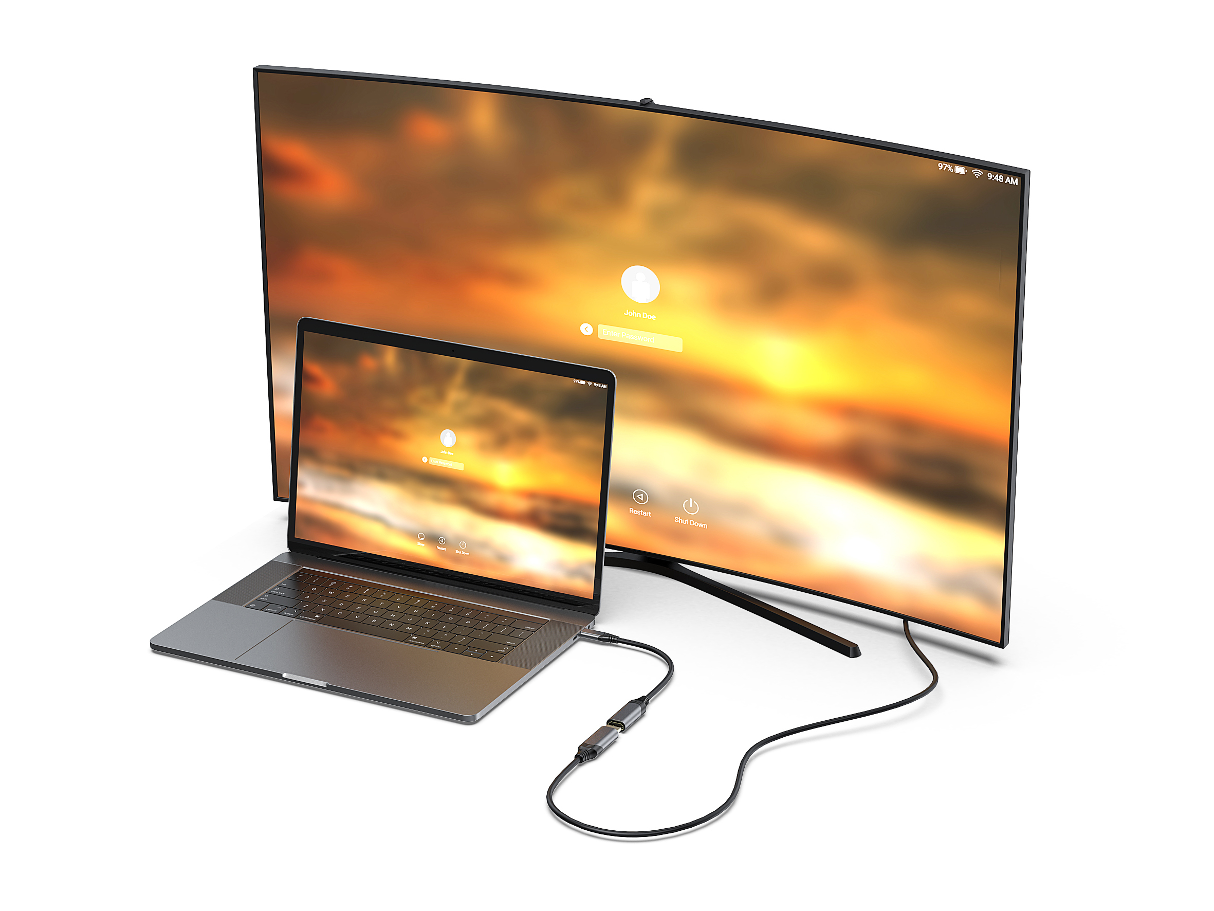 Laptop podłączony do dużego ekranu, pokazujący zachód słońca.