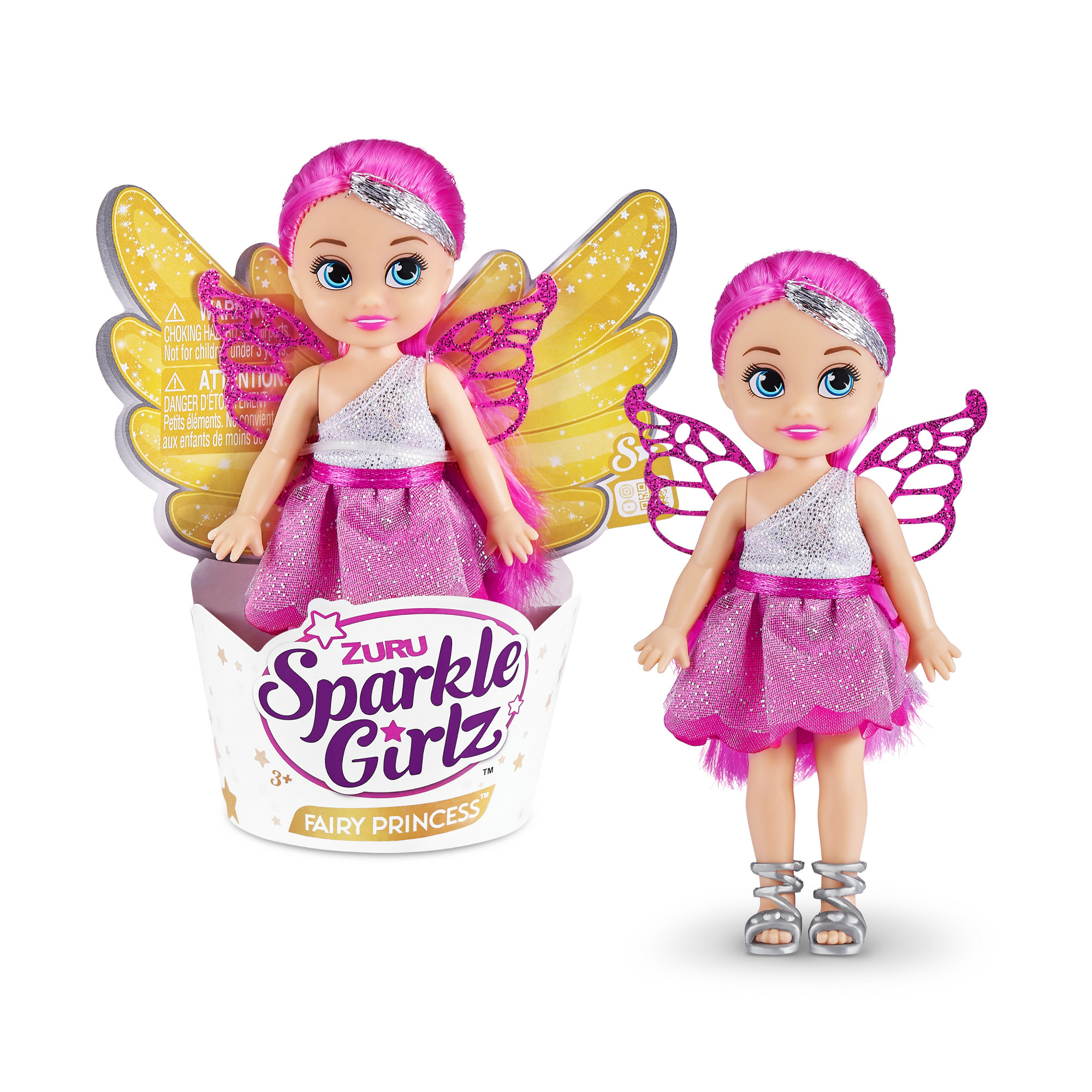 Zwei Feenpuppen in einer Box. Sie haben rosa Haare, silberne Stirnbänder, rosa Kleider und Flügel.
