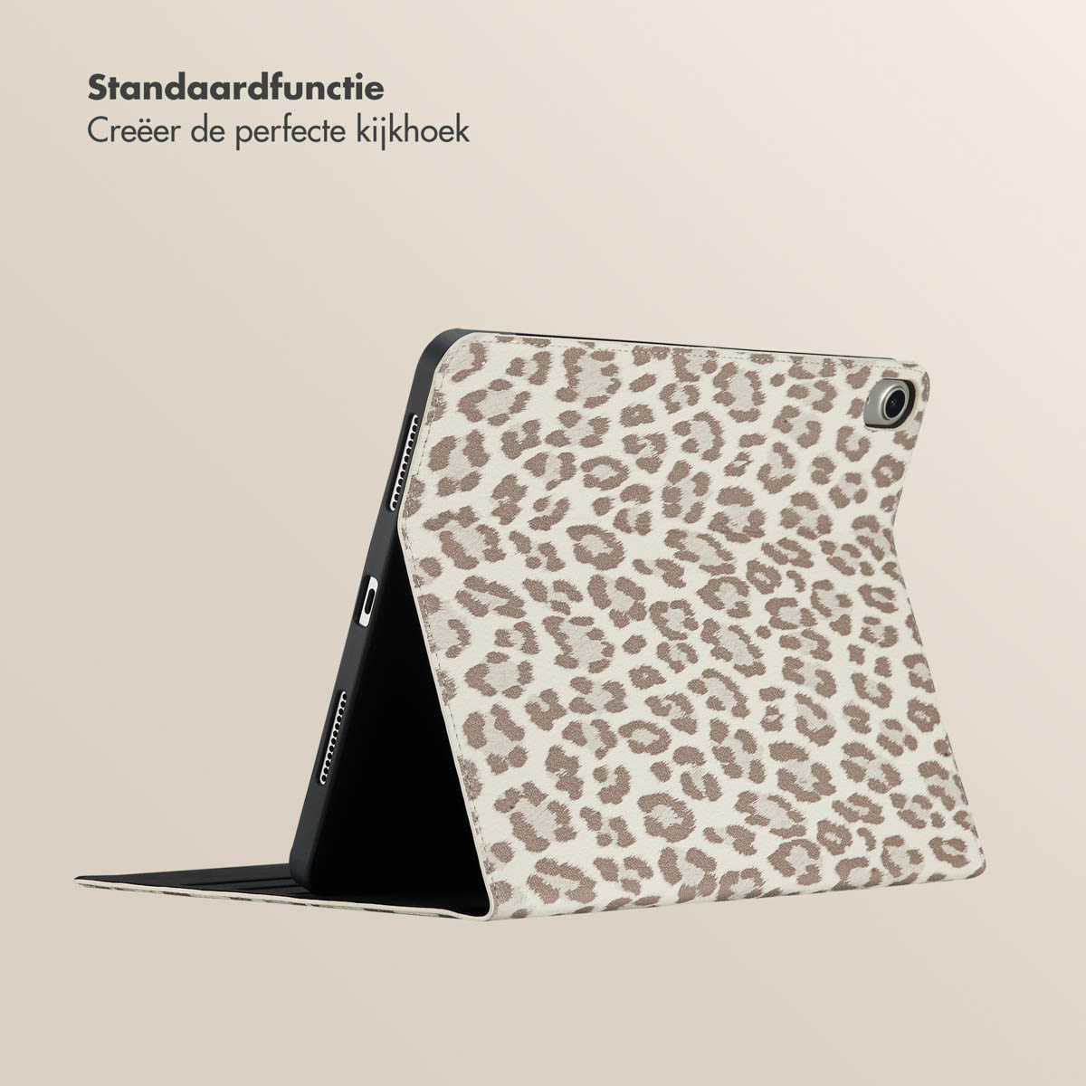 Tablet case open, leopard print, brown spots on beige, stands on beige surface.