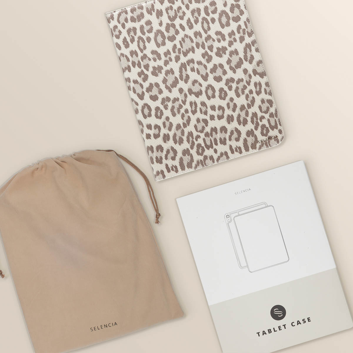 Tablet case, pouch, and instruction sheet on a light background. The tablet case has a leopard pattern.